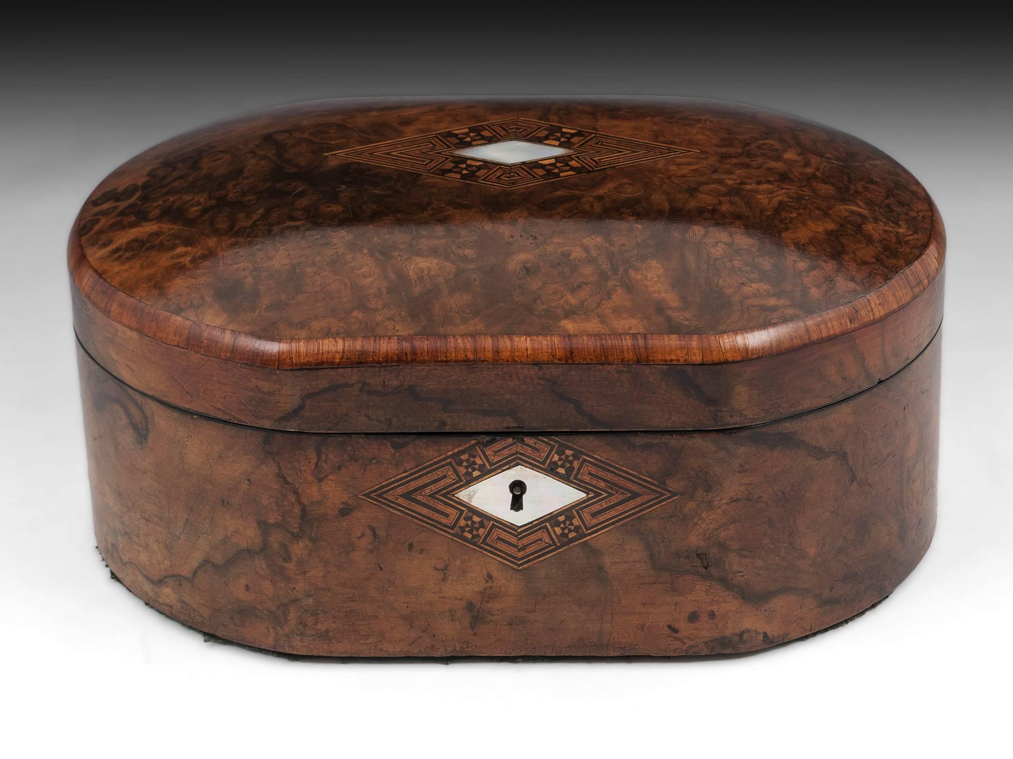 Antique Figured Walnut Jewelry Box with mother of pearl escutcheon and initial plate with tunbridge style borders. The box is edged in crossbanded tulipwood. 

The interior is lined in maroon padded velvet and silk paper. 

This jewelry box does