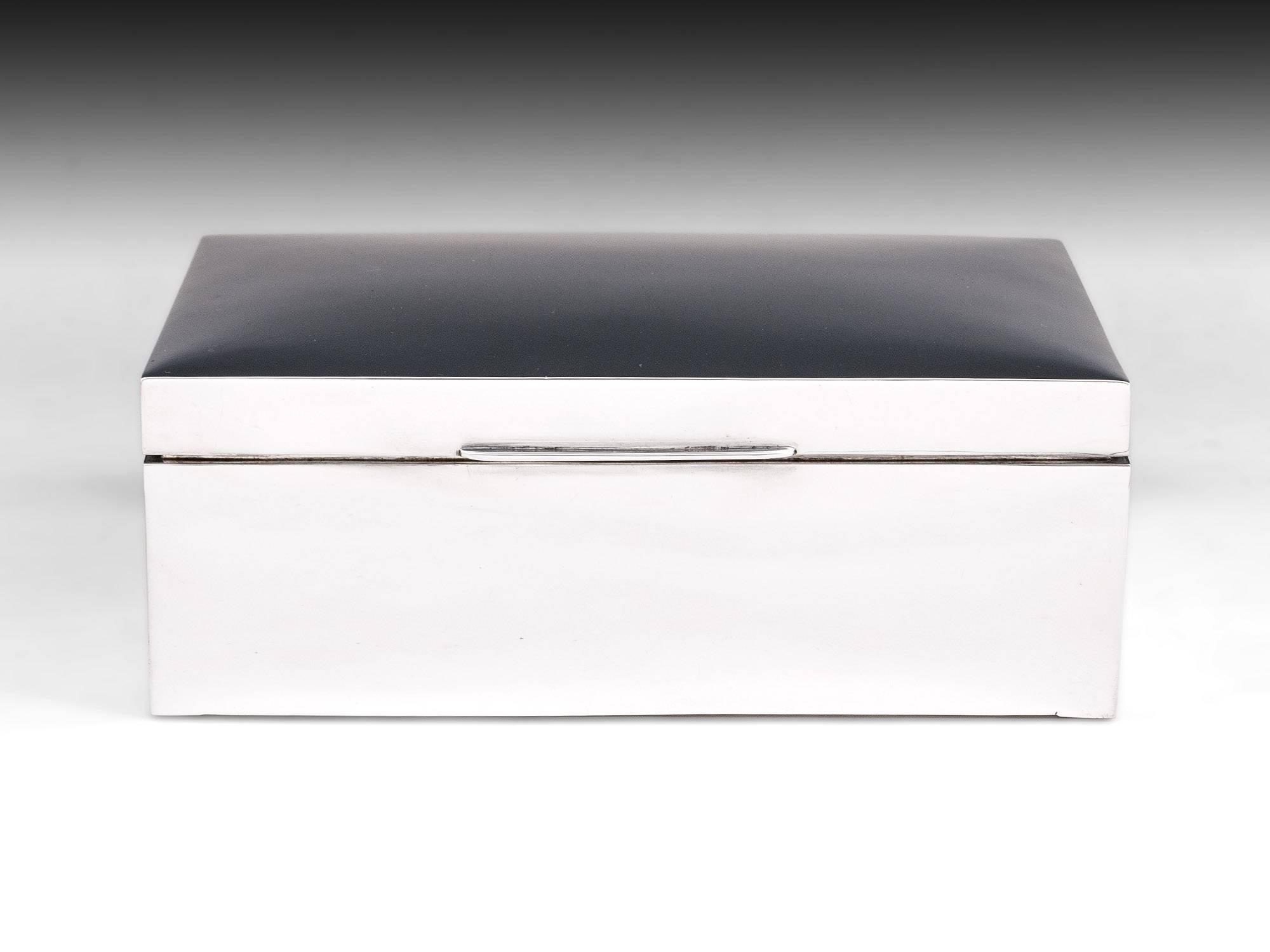 Sterling silver smooth cigar box by Birmingham Silversmith: Wilmot Manufacturing Co. 

Simplistic Cigar box of true quality, the interior is lined with cedar wood to keep the finest Cuban cigar fresh.
     