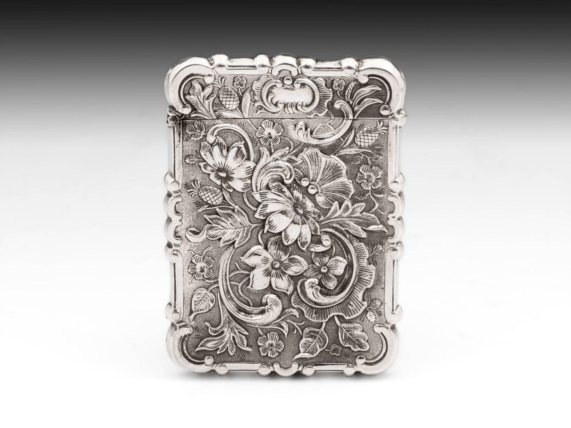 Ornate Silver Card Case by American Silversmith Leonard & Wilson. With a castle view on one side, and a beautiful floral design on the other and scrolling edge shape to the castle card case itself. 

On the inside edge of the lid close it is