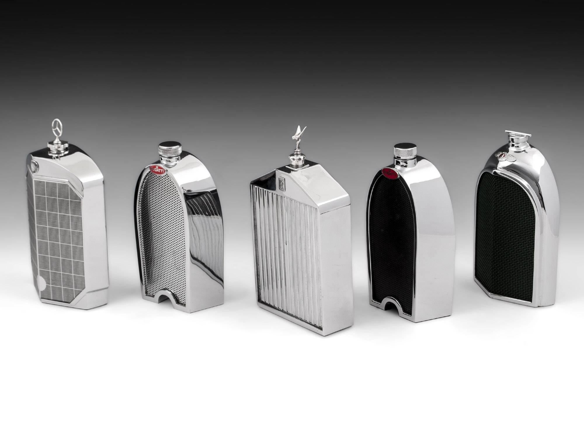 A group of car radiator decanters comrpising chrome bodies wrapped around a single glass decanter. Each with a viewing slot so you can view the spirit levels and not over fill. 

Both Bugatti and bentley decanters have realistic red enamelled