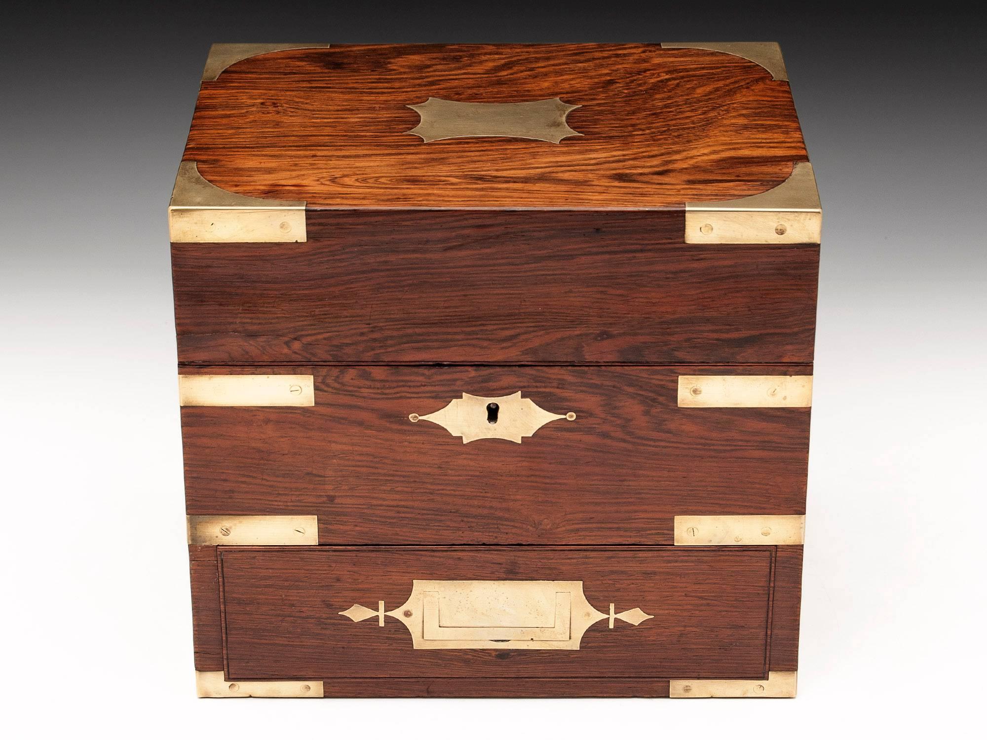 Apothecary box / Medicine chest veneered in stunning Rosewood with brass corner supports for added strength, brass escutcheon, initial plate, flush fitting drawer and military carry handles. Contains original contents and has fantastic patination.