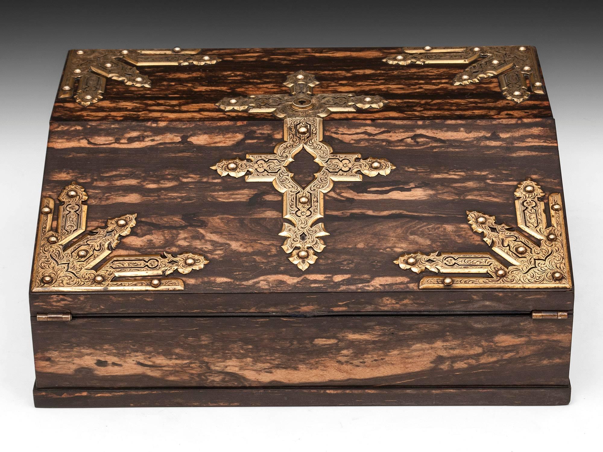 Betjemann Coromandel & Satinwood Writing box with stunning veneers, engraved gilded brass decoration and escutcheon. 

The interior features a blue velvet and gold tooled writing surface which the top half can be lifted to reveal a solid satinwood