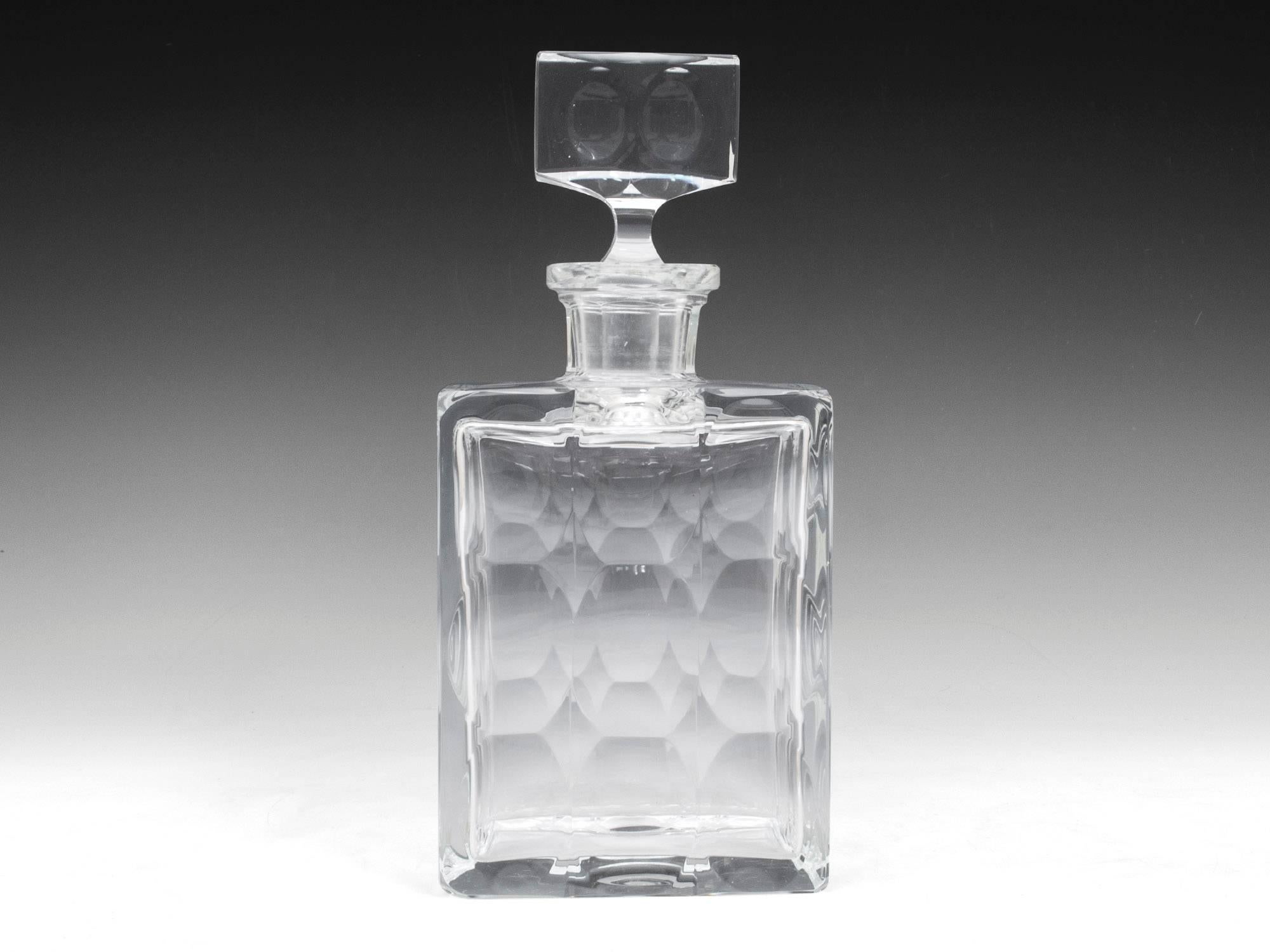 Large eye catching Whiskey Decanter with unusual decorative oval dimple cuts. Complete with faceted stopper. The base is marked Moser 

Moser glass is made by a Bohemian (Czechoslovakian) glasshouse founded by Ludwig Moser in 1857 

Shipping