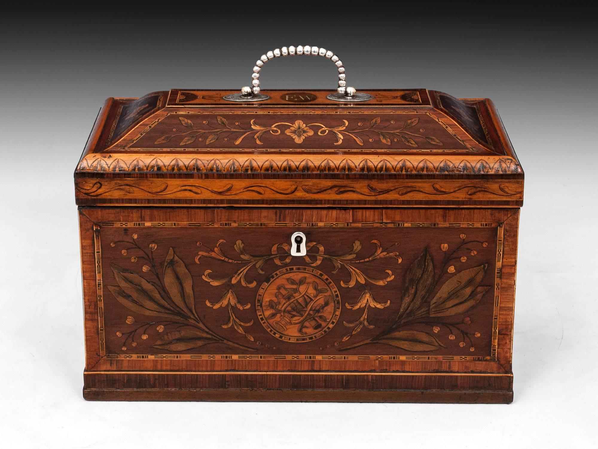 Tea chest veneered in harewood with boxwood edging, and tulipwood and kingwood crossbandings. This chest has an array of fabulous stained sycamore inlays with leaves and flowers, which have been engraved and enhanced with penwork decoration. This
