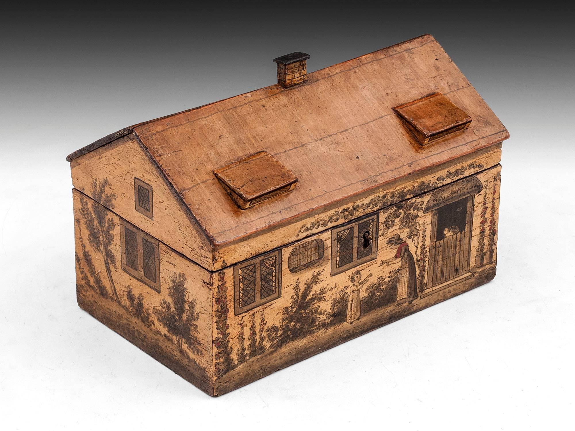 Tunbridge ware cottage sewing box made of solid sycamore. The cottage sewing box is painted more finely than most we have seen and quite sweet with mother and child. The front also features mullioned windows, stable door with a cat sat on the top,