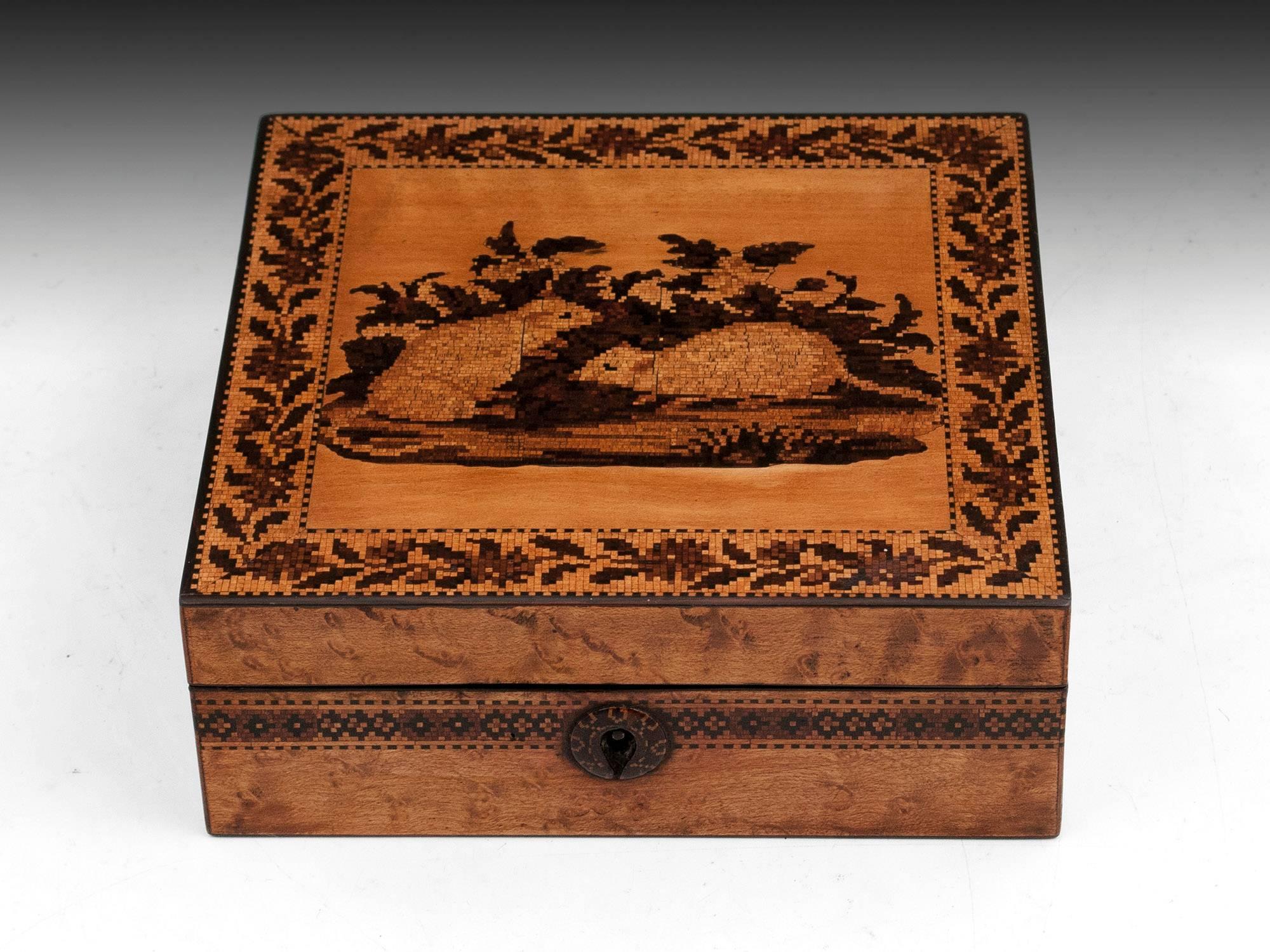 Tunbridge ware box with a scene of two mice on the top, surrounded with floral borders, veneered in water stained maple. 

The interior of this sweet Tunbridge box is lined with silk. 

This Tunbridge ware box comes with a fully working lock and