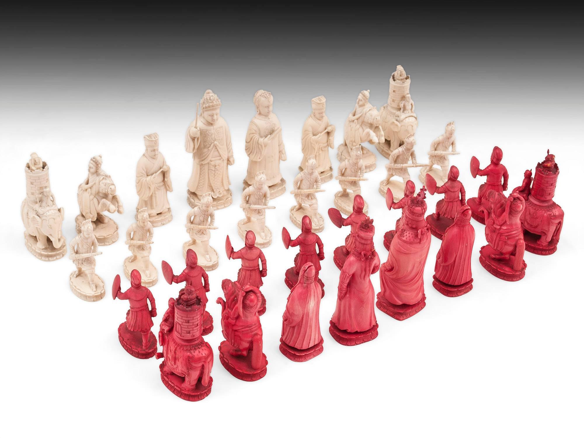 Georgian Asian chess set comprising of natural and red stained ivory pieces, beautifully carved with an exquisite attention to detail. 
The red stained pieces are King George III and Queen Charlotte, and the natural pieces King and Queen are an