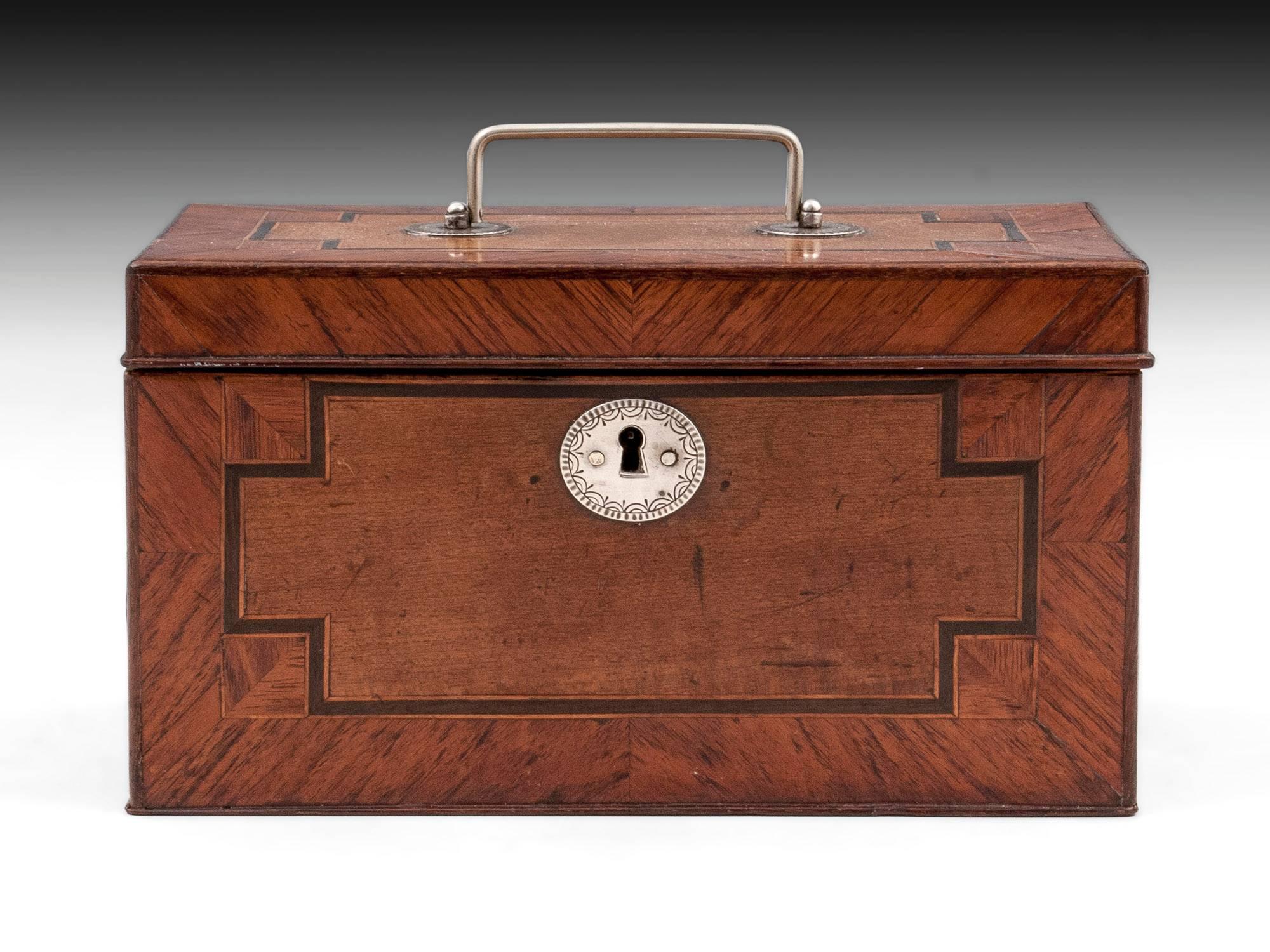 Antique tea chest veneered predominantly in hare wood with decorative crossbanded kingwood and ebony. The tea chest has a silver handle and engraved silver escutcheon.

The interior of this lovely tea chest features three compartments with