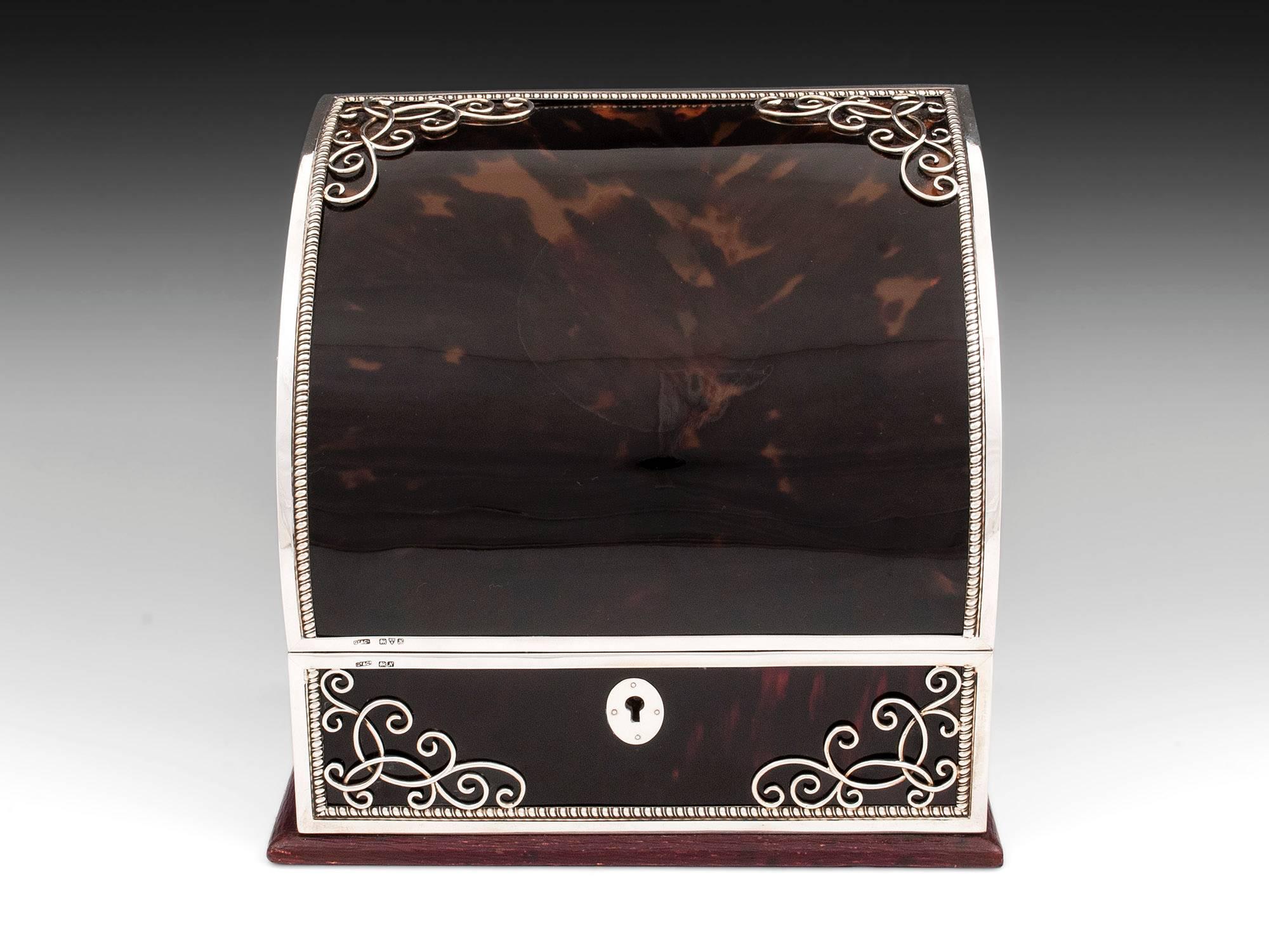 Tortoiseshell and sterling silver stationery box and blotter by Chester Silversmith Grey & Co. Both have wonderful decorative scrolling sterling silver in the corners. 

The interior of the stationery box features several compartments lined with