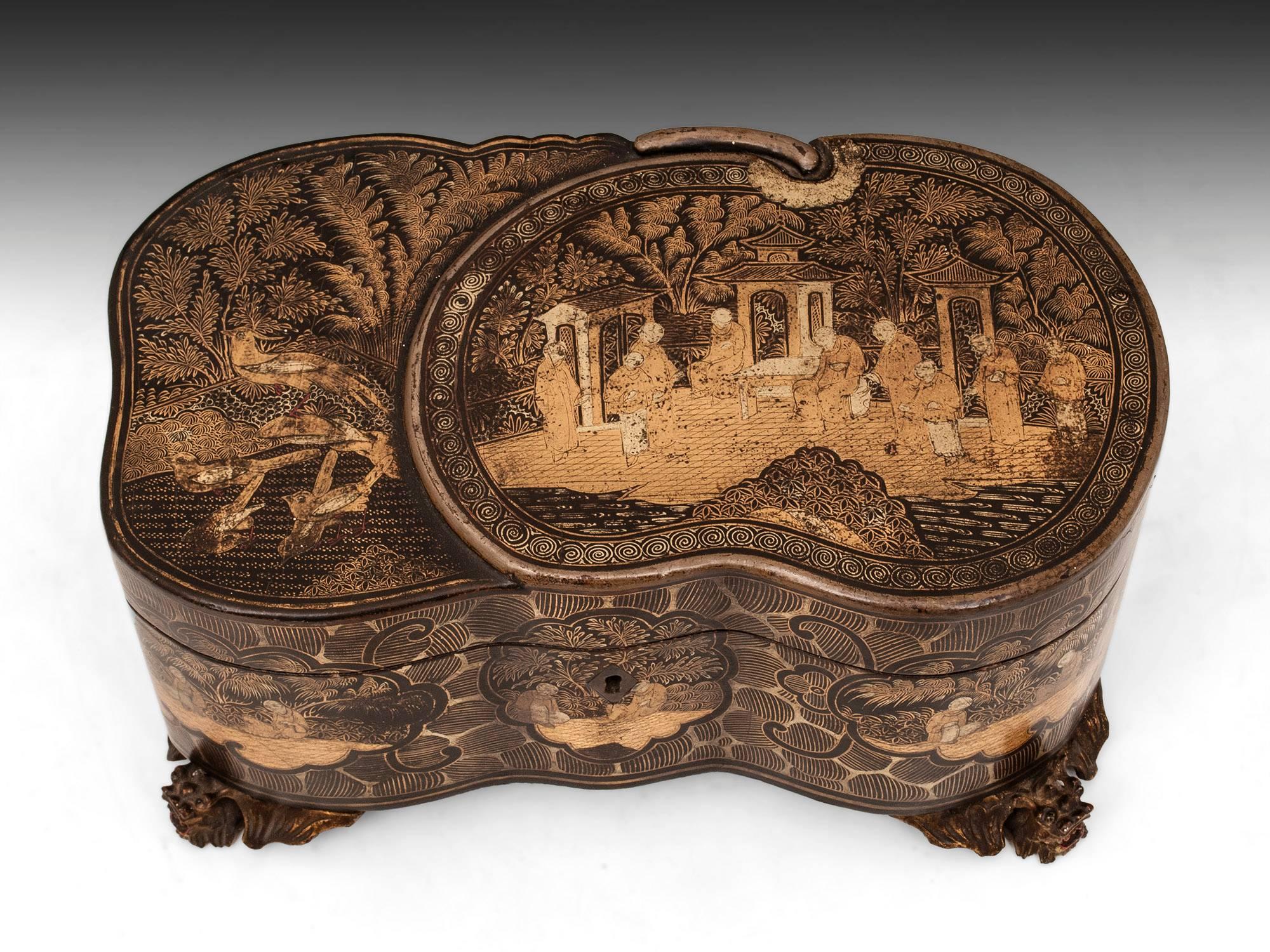 Unusually shaped lacquer tea chest with a raised form panel of a melon. Beautifully decorated with gold Chinese figures in ceremonial poses, as well as birds and landscapes, all of which have religious and traditional symbolism. The interior