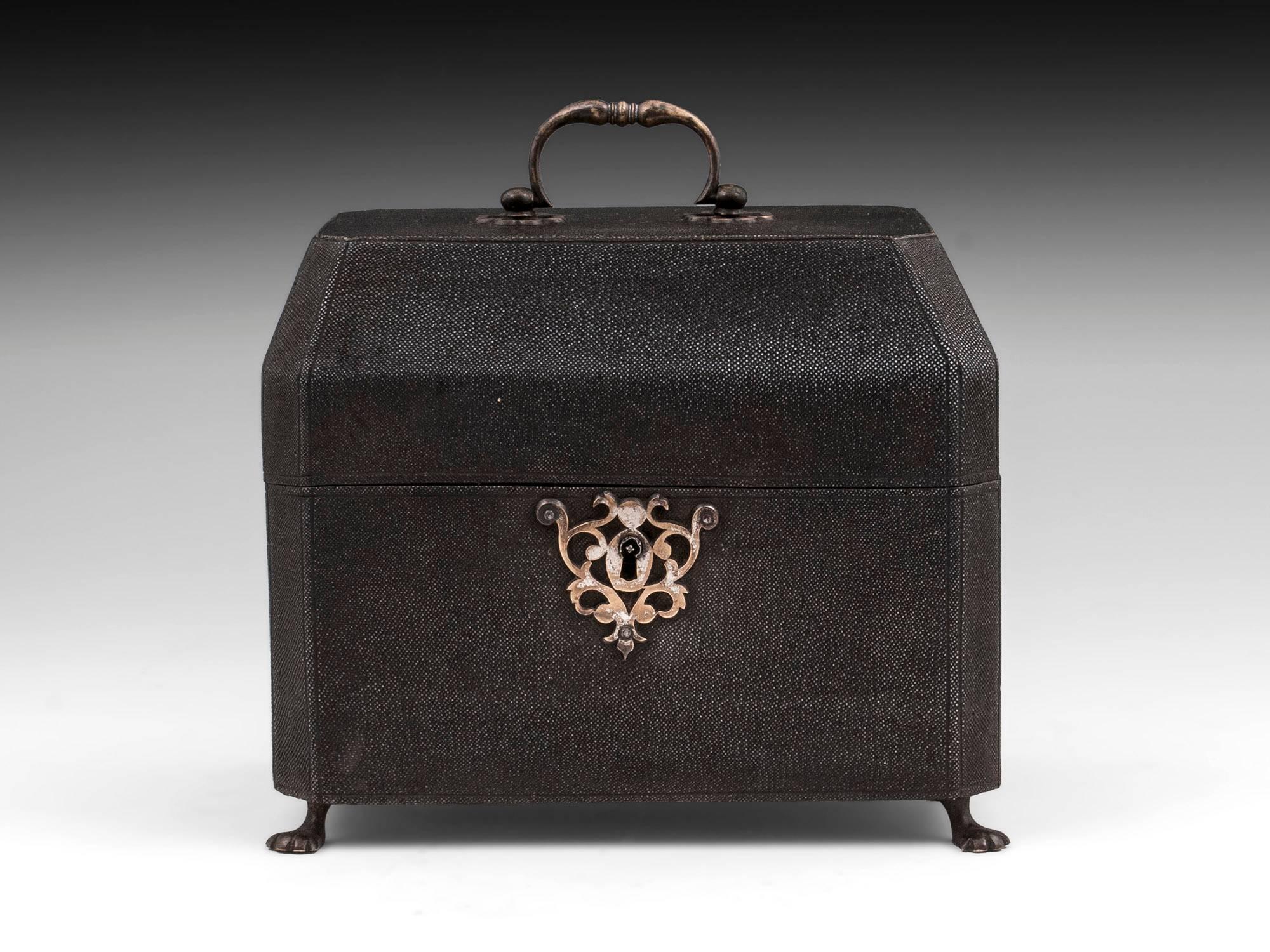 A stunning tea chest incorporating a pair of George III silver tea caddies by London silversmiths Smith & Sharp 1762, housed in a green velvet-lined, brass-mounted shagreen case. The silver tea caddies, of an elegant bombe´ shape, have embossed