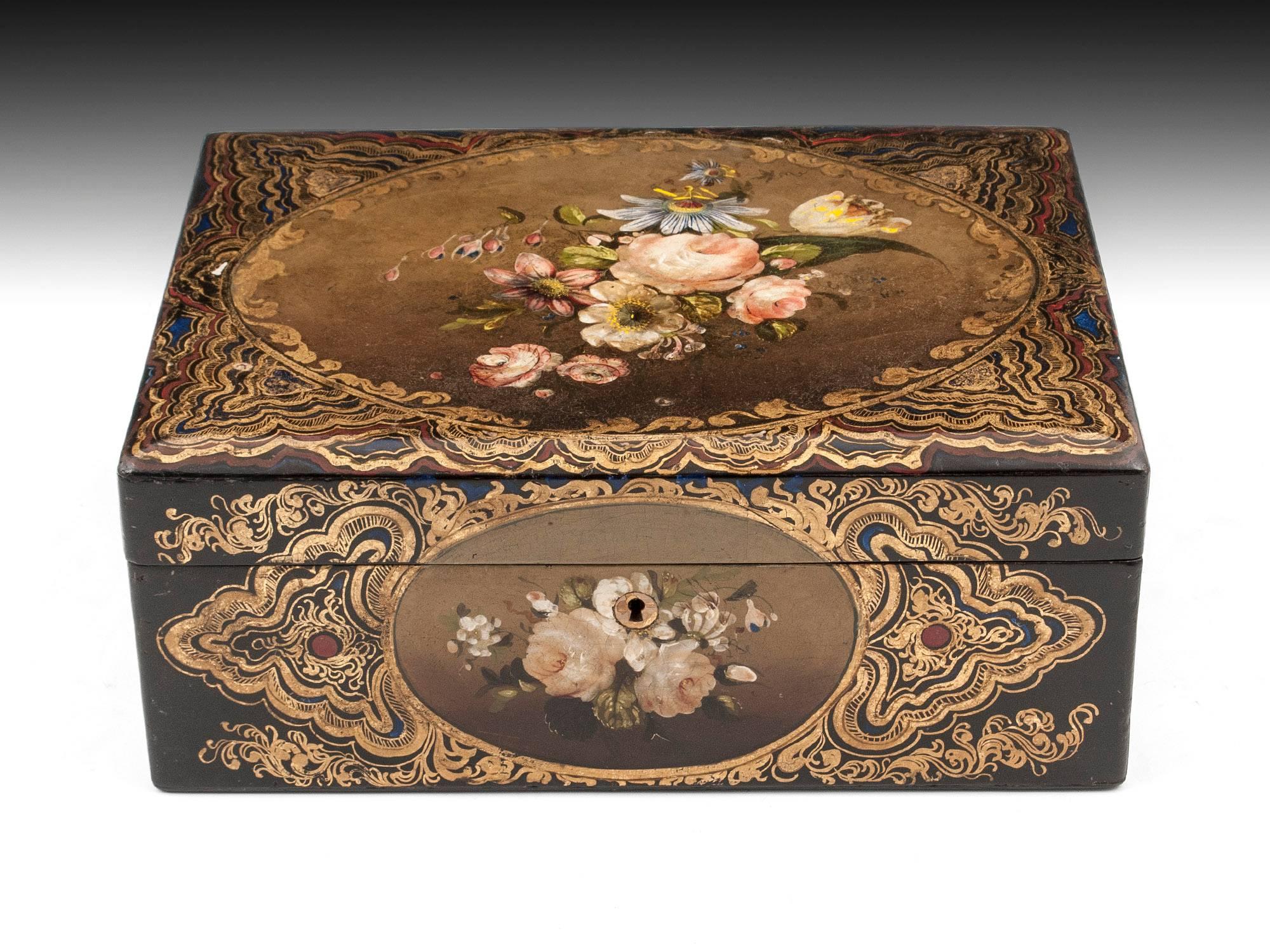 Papier mache sewing box painted with sprays of flowers, all brought to life with oval-framed trailing & scrolling gold leaf decoration, with beautiful vibrant colors and detailed pictures. 

Sewing box interior is equally as stunning as the