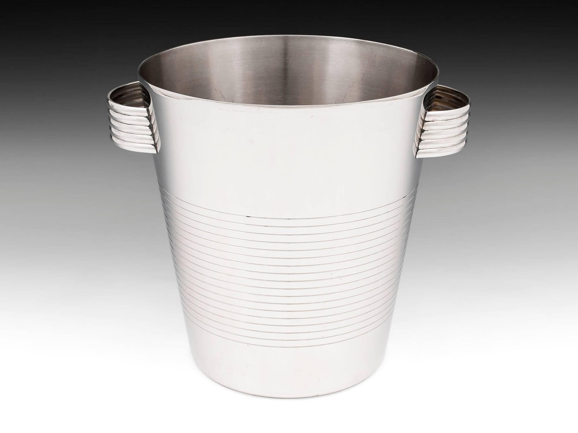 Vintage stainless steel champagne bucket with engraved striping around the body and ribbed handles. Very stylish ice bucket by Inox of France.