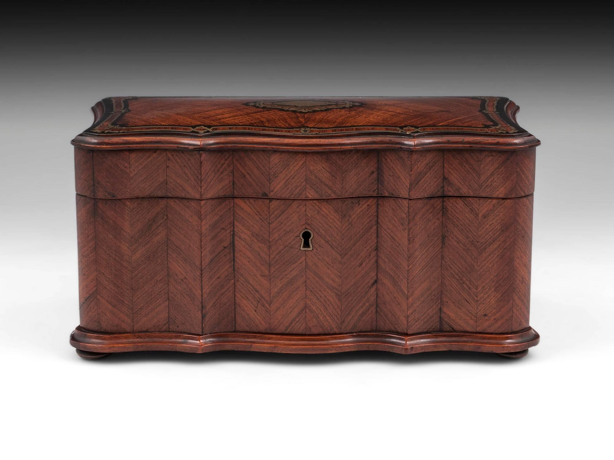 Kingwood triple serpentined tea caddy with engraved brass inlay bordering the top, including an ornate initial plate. The interior of this French tea caddy is veneered in Rosewood and features two lidded compartments with wooden handles, decorated