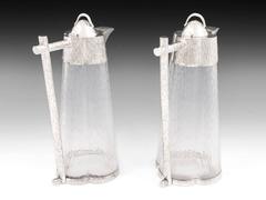 Art Deco Wine Claret Jugs in the manner of Christopher dresser.