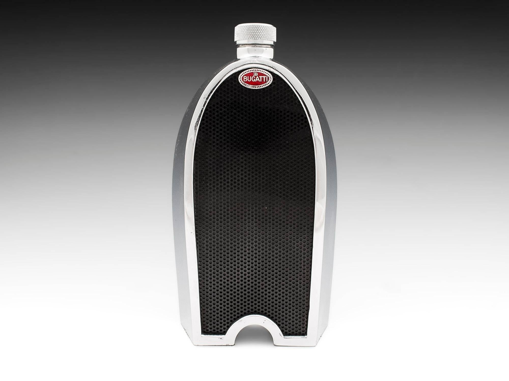 Chrome Bugatti spirit decanter by Ruddspeed Ltd with super red enamelled Bugatti badge and black grill, all encased around a single glass decanter. On the back of the decanter shows its spirit level so when removing its radiator screw top decanter