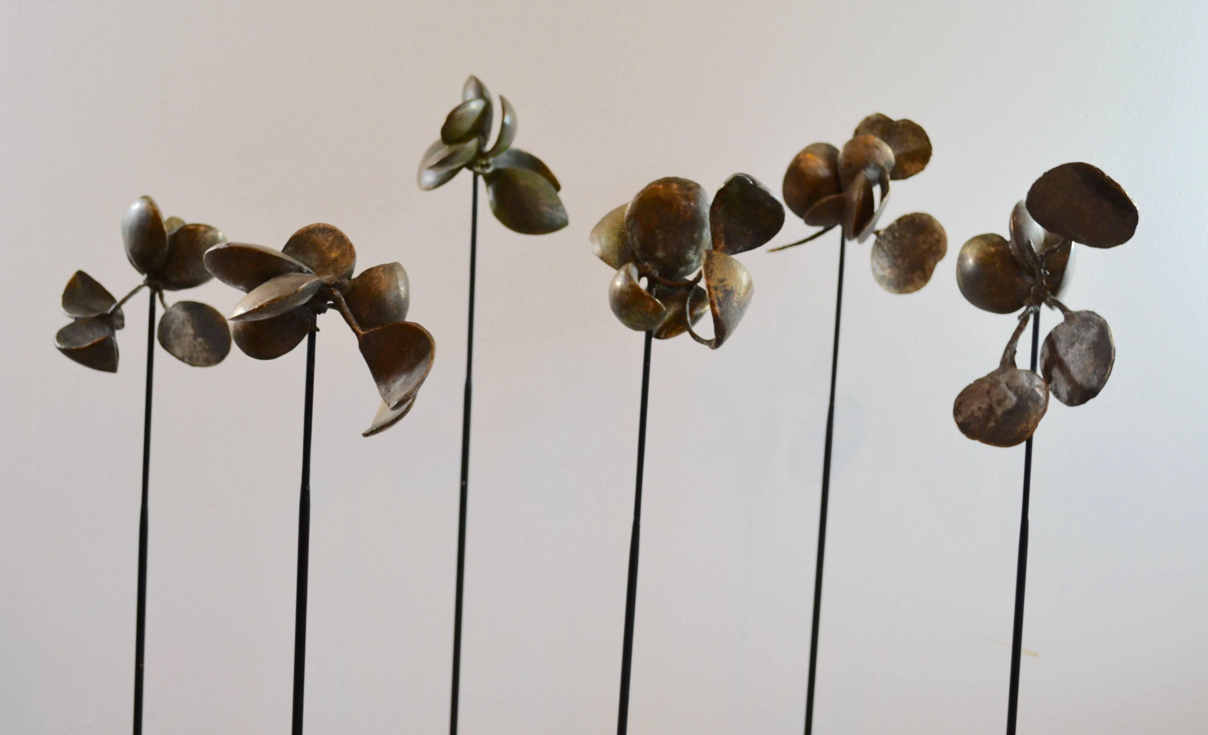 Suspended bronze flower petals mounted on metal rods. Highly finished bronze with a beautiful patina. Each one of a kind sculpture is handcrafted by the artist, Sharon Wandel, elected member of the national academy of design NYC, 1994. Please note
