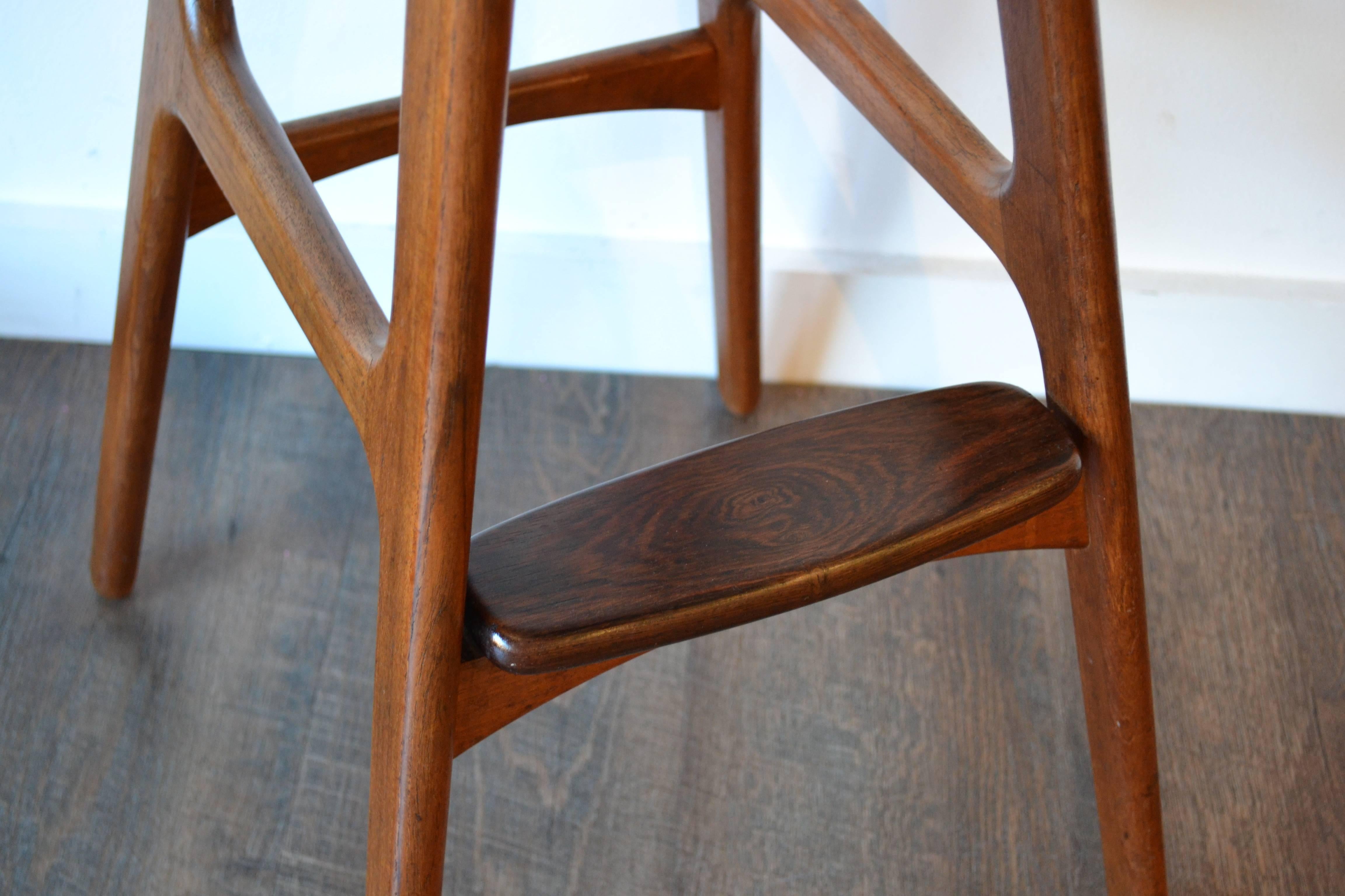 Iconic bar stool designed by Erik Buch, Denmark 1970s, teak frame with rosewood footrest, original leather seat.