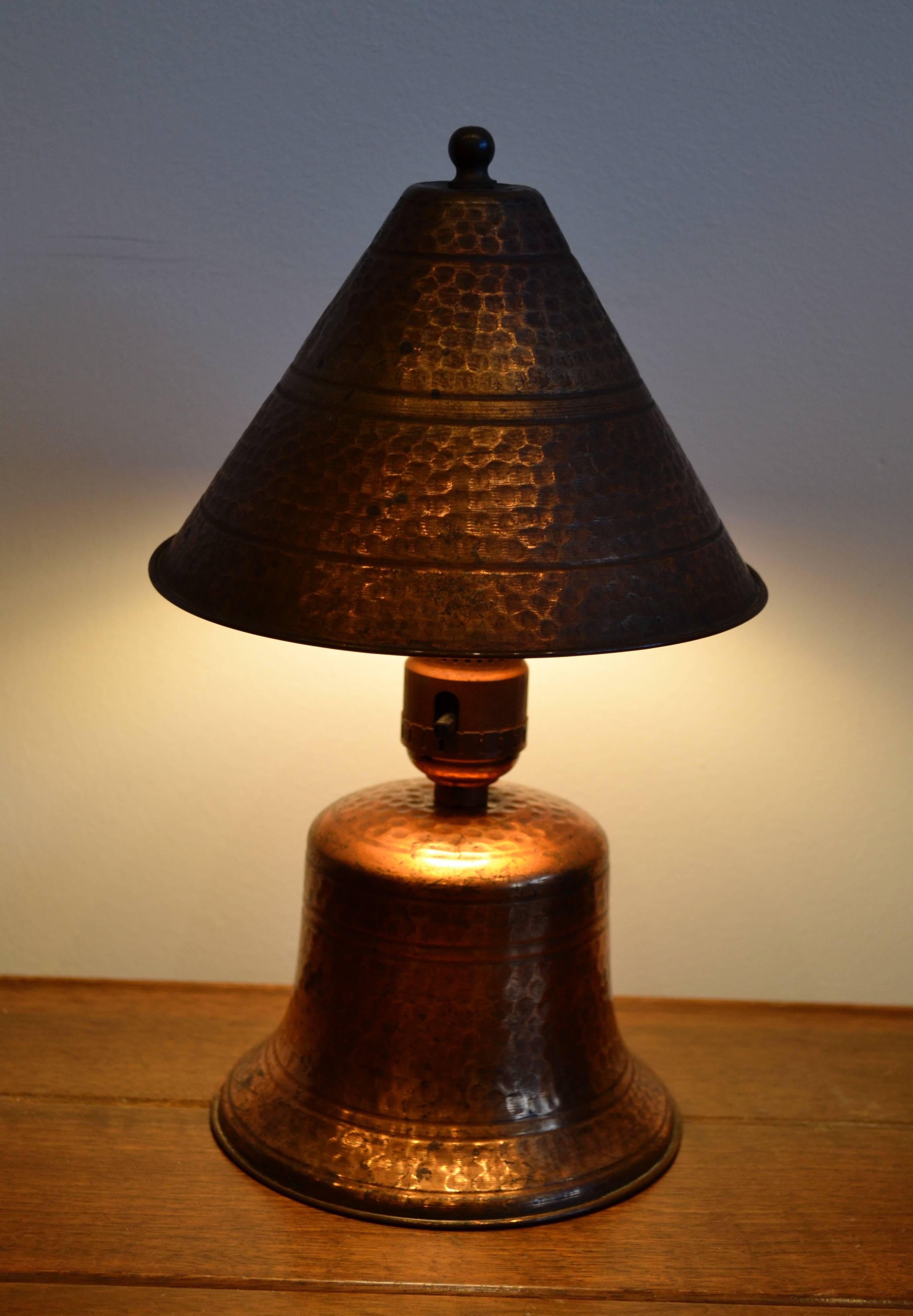 Early 20th century hammered copper petite desk lamp.  Rewired.