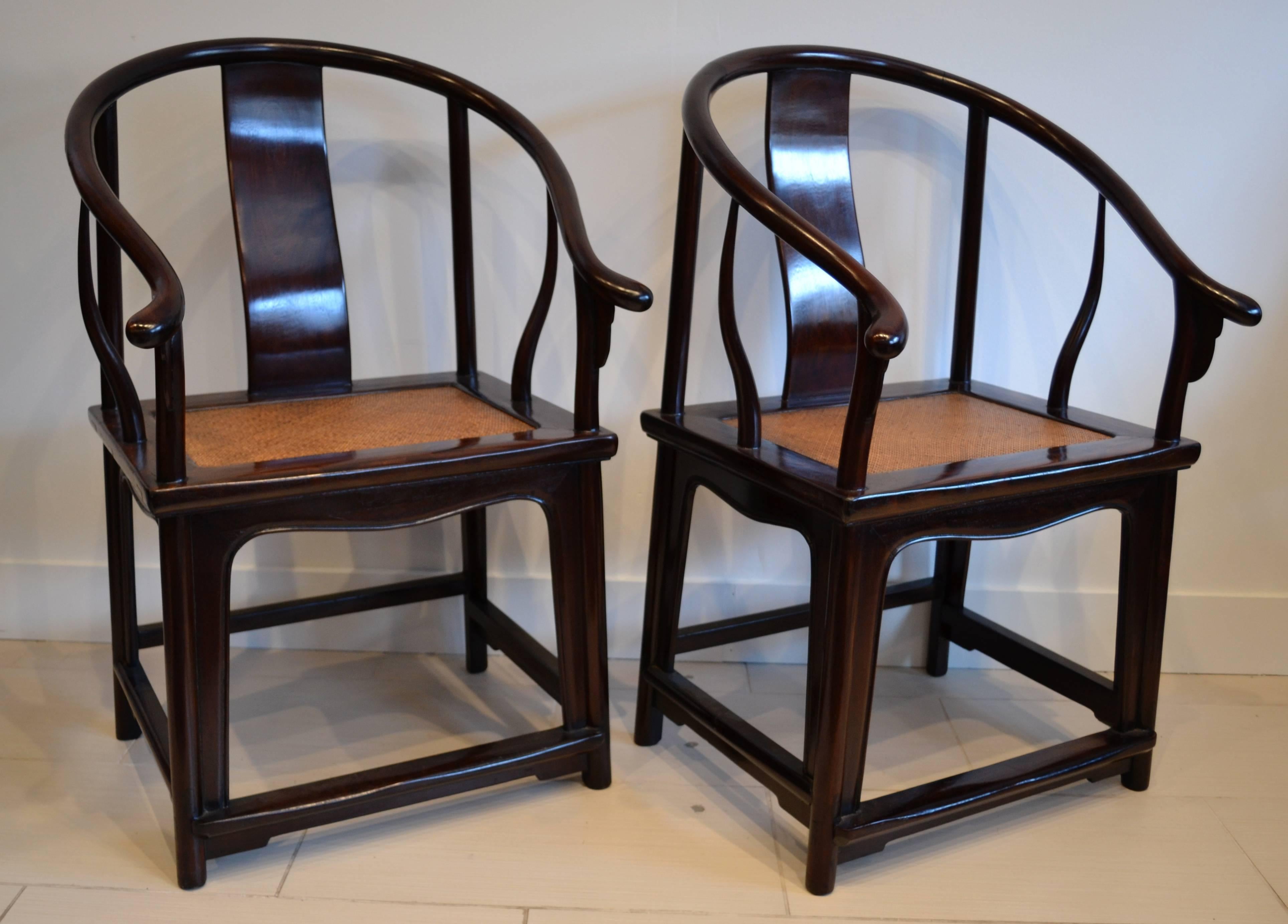 Impressive pair of Chinese horseshoe back caned seat arm chairs, constructed of Chinese elm. heavy and beautifully made. gorgeous patina.