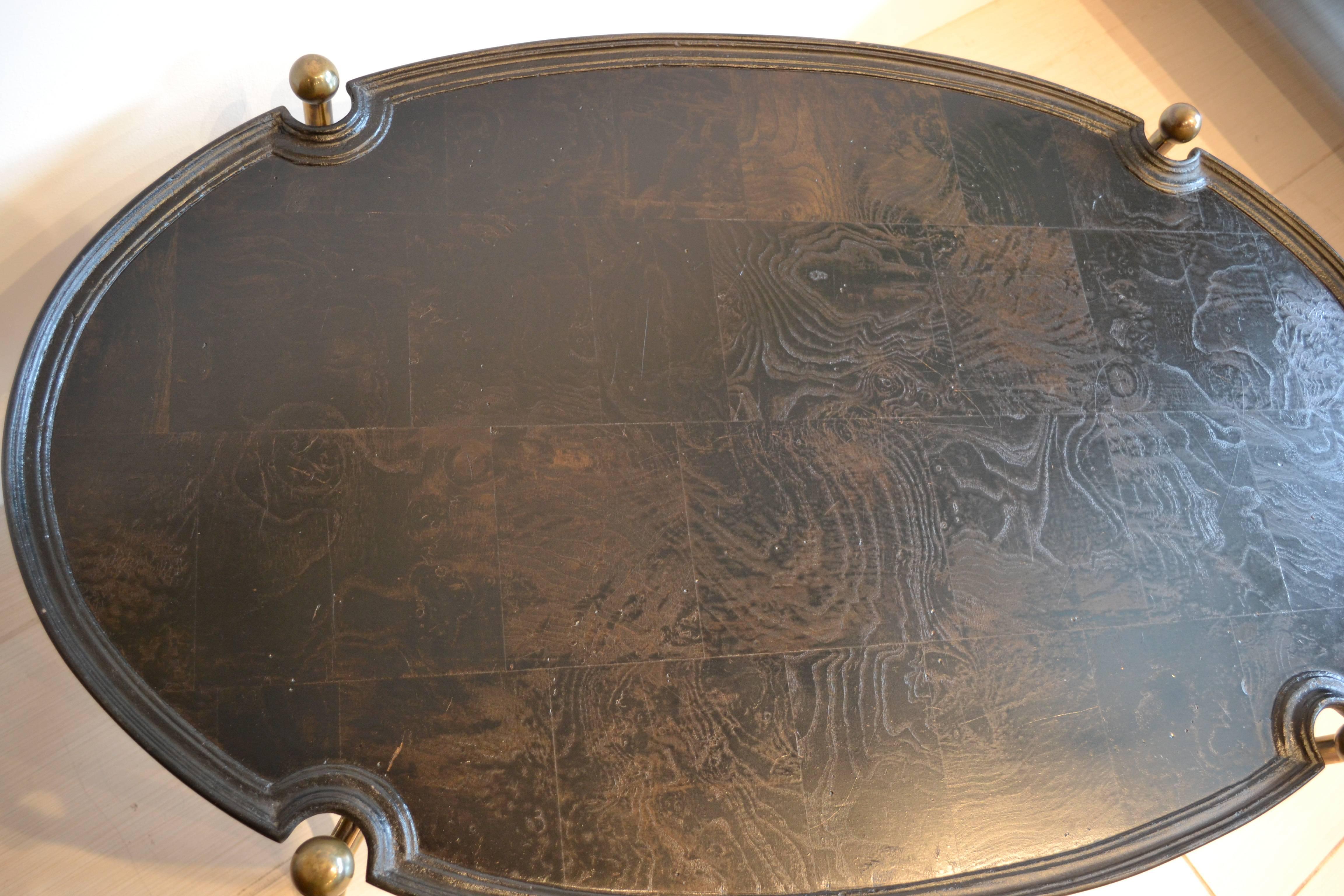 Ebonized parquet wood top with beautiful patina. Tray top appears floating but is attached to the brass ball footed base.