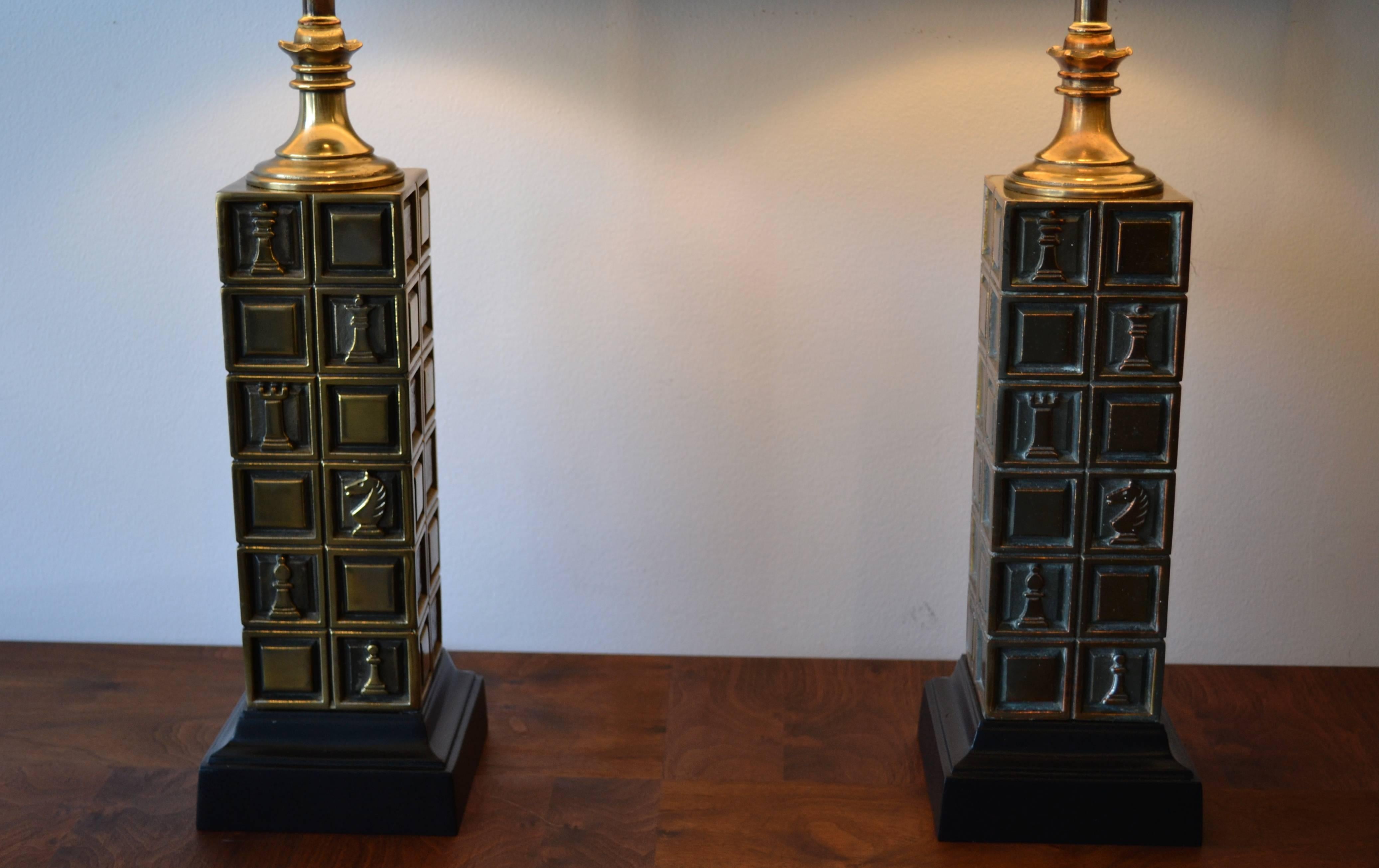 Fabulous pair of Mid-Century Modern brass chess piece table lamps with wood base. In excellent condition. All original. Expertly rewired. Perfect for the den or library!