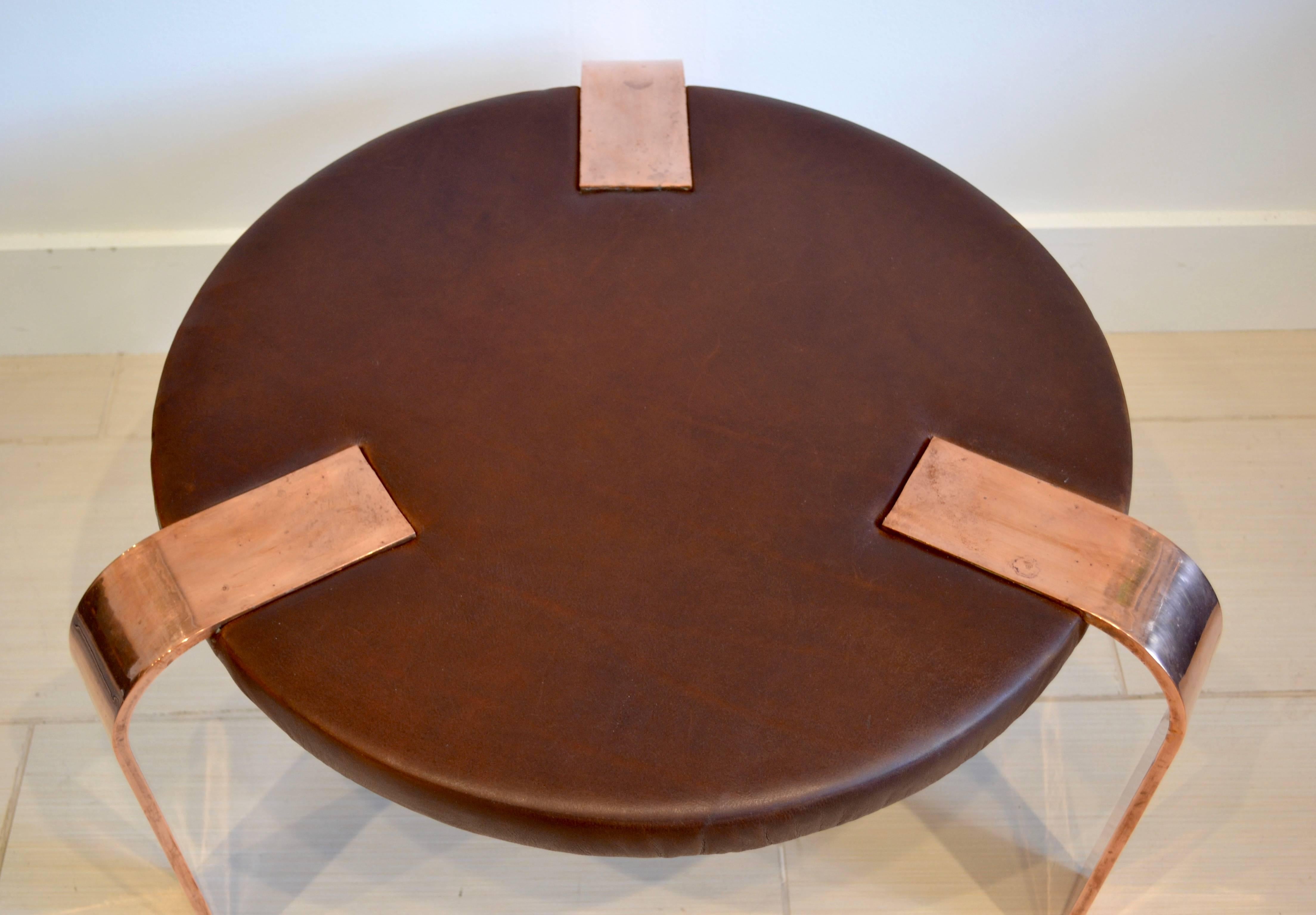 Truly unique and incredible arts and crafts table by Donald Deskey made of leather with flat copper legs. Can be used as a side table, coffee table  or ottoman. Beautifully made. Excellent condition, 1930s.