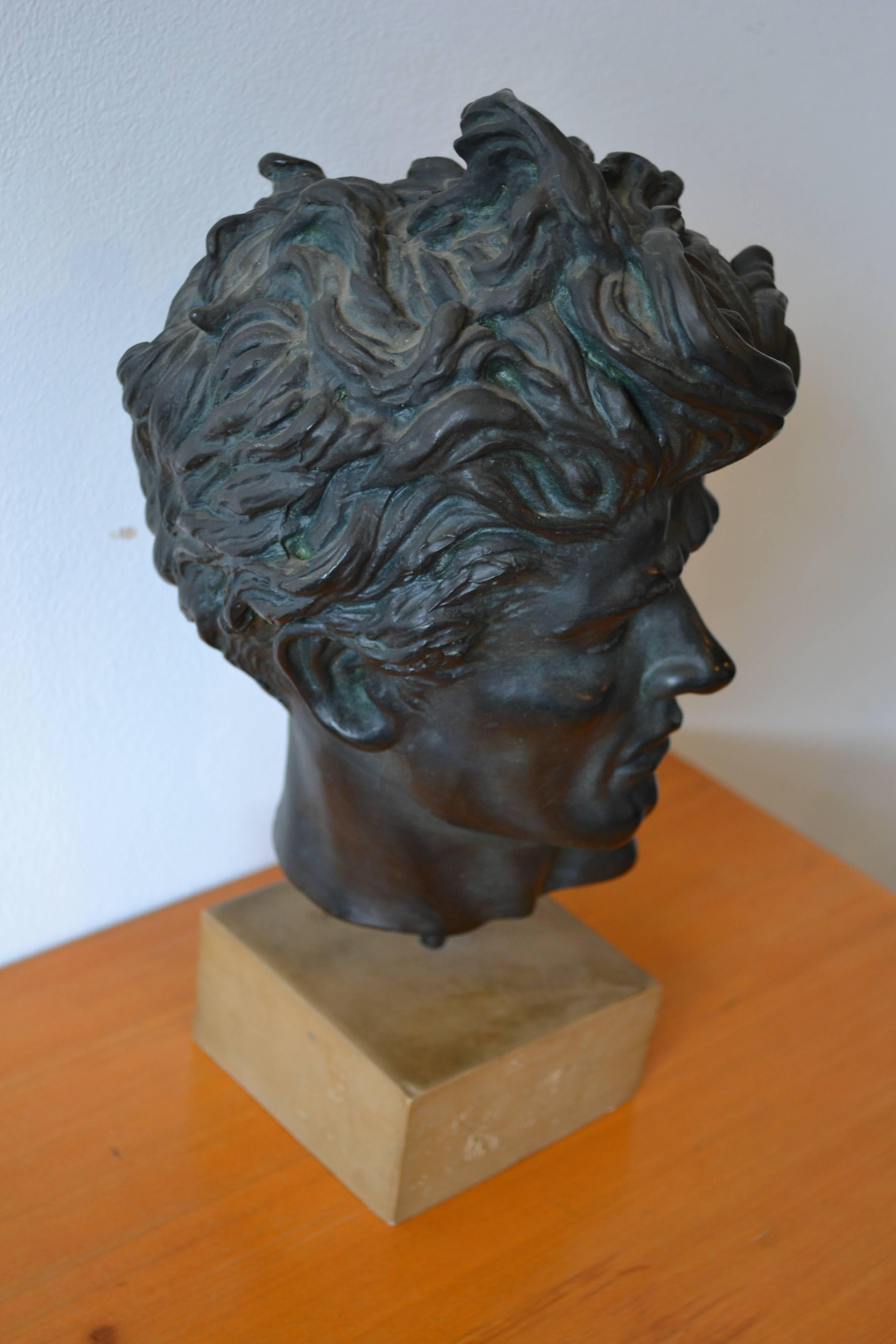 Mid-Century Modern male sculpture titled "Heroic Head" by Edward Melcarth, signed and dated. Made of black resin. Great modern period piece. Great size for table top or book shelf. 10 inches x 7 inches x 7 inches