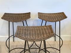 Three Arthur Umanoff Iron and Rattan Bar Stools