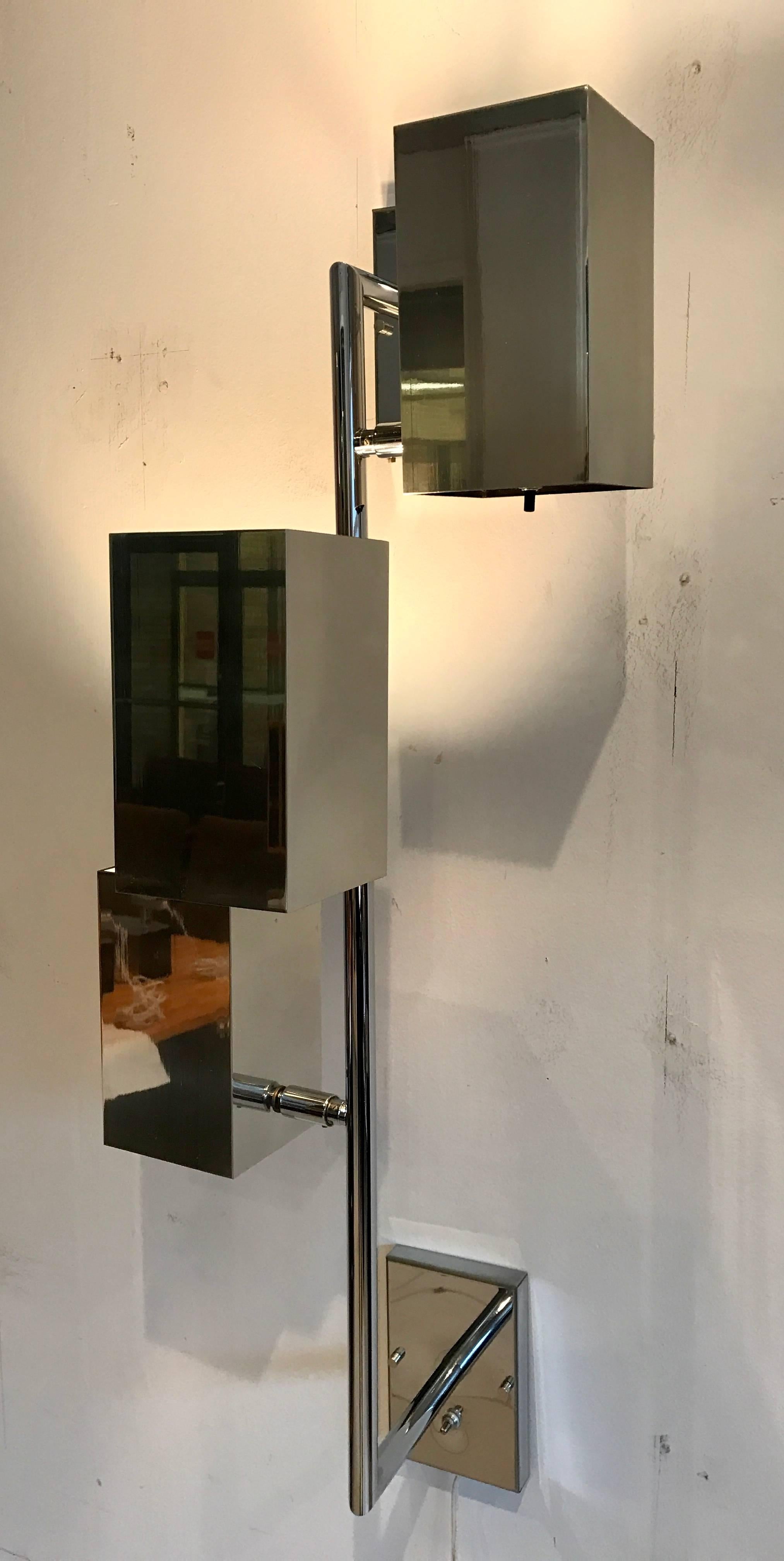 Awesome polished chrome three box shaped wall light by Koch & Lowy Lamp Co. The three lights are fixed onto a chrome pole which is affixed to the wall with two back plates measuring 4 inch wide by 6 inch high by 3/4 inch deep. Great design!