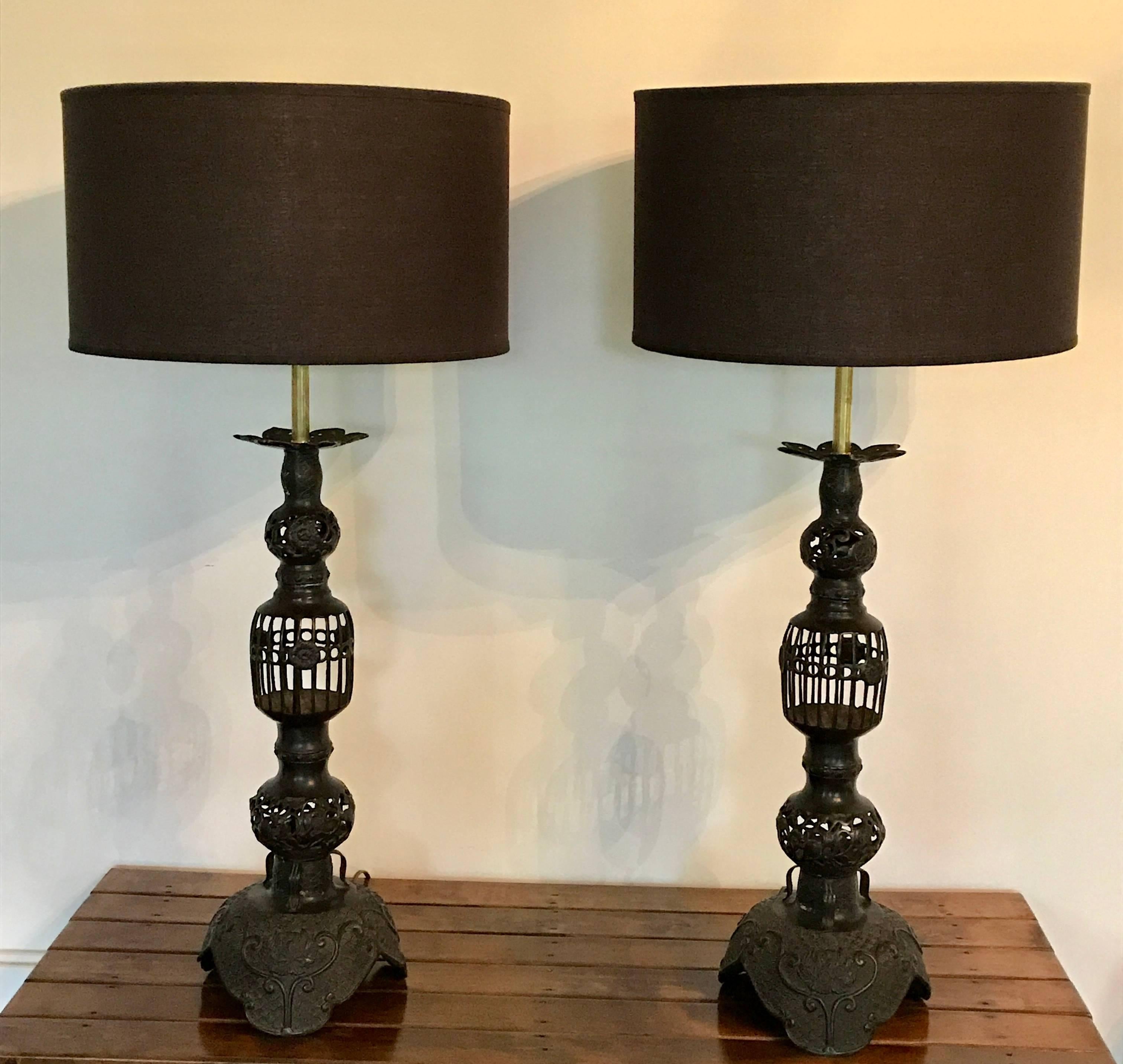 Impressive pair of Japanese candleholders made into table lamps in the mid-20th century. Recently re-wired including beautiful brass hardware. Shades not included.