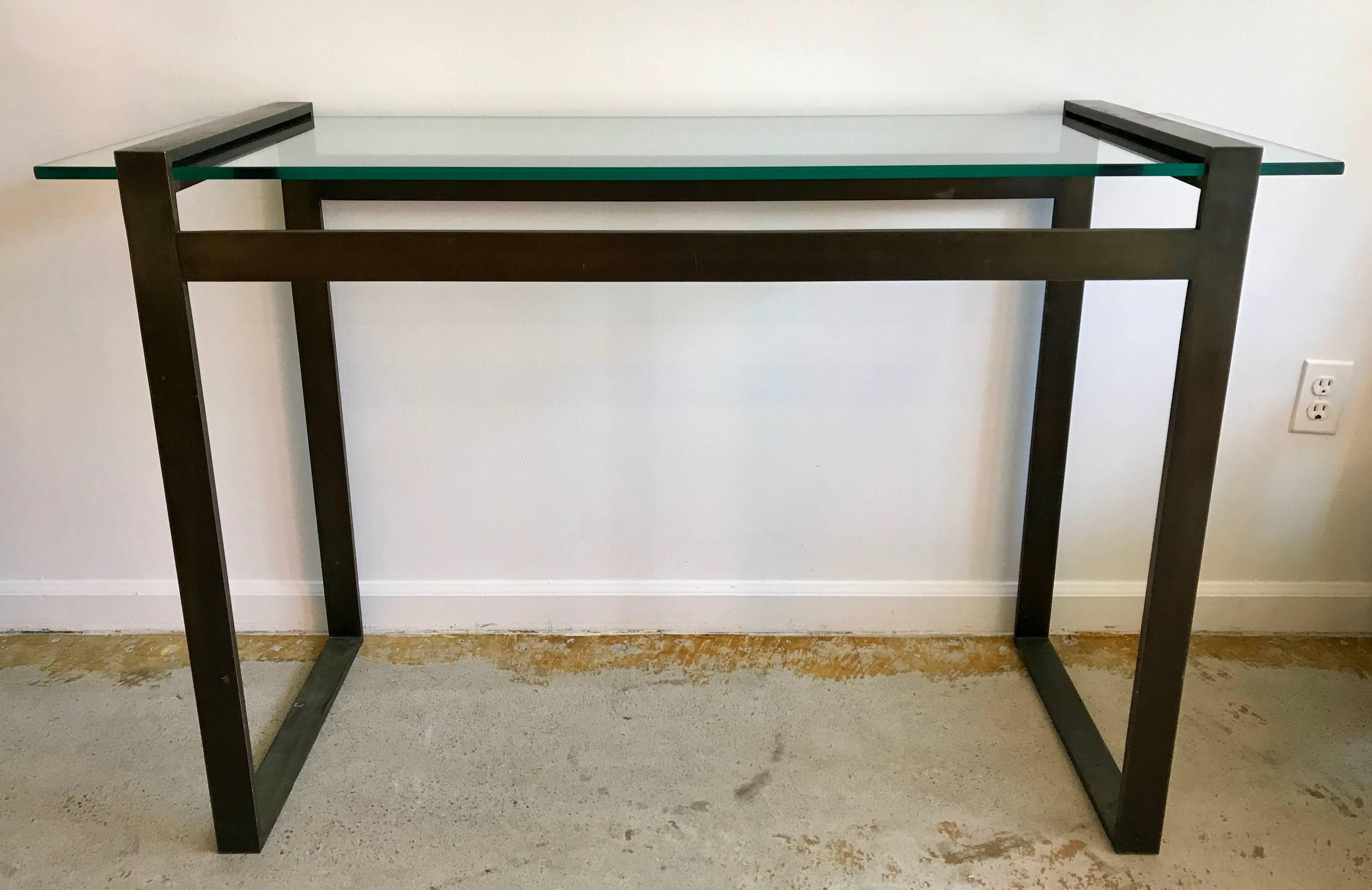 Amazing console or foyer table with bronze base and new floating glass top. The Box Line collection was designed by Charles Hollis Jones in the 1960s. The bronze base is very heavy and has a beautiful aged patina, new half inch glass.
