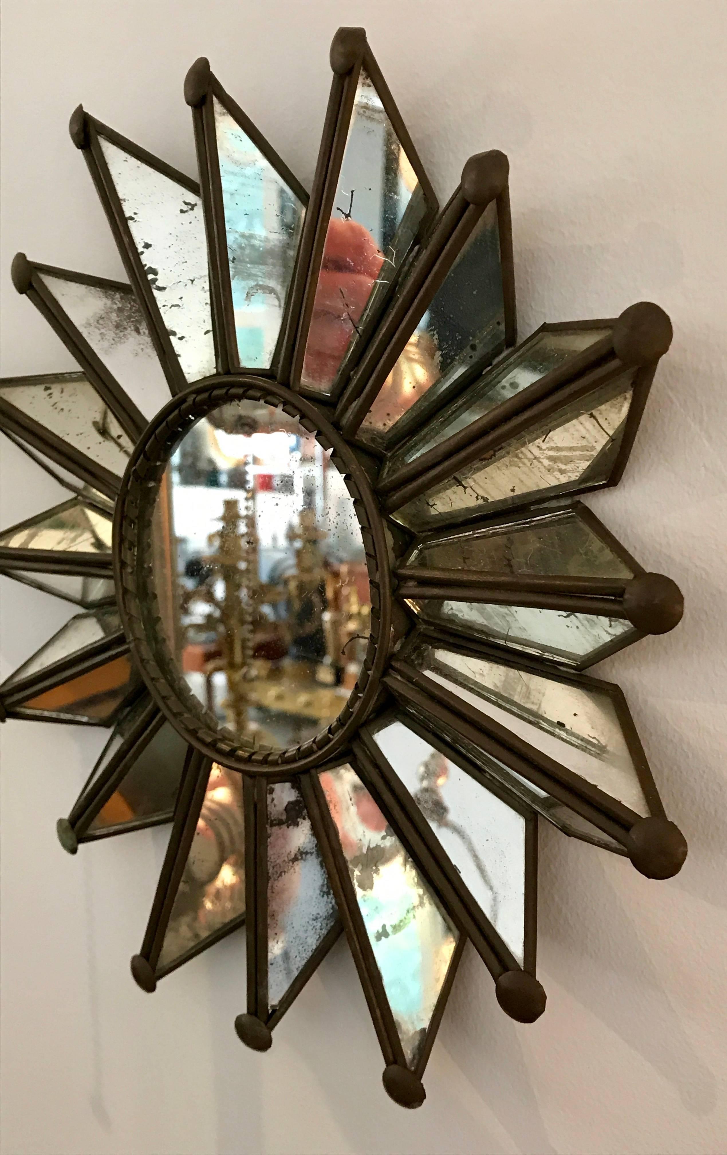 Very cute vintage sunburst mirror with beautiful patina, copper frame. All original no chips or cracks.