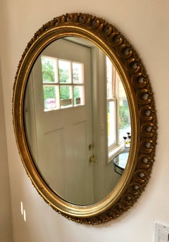 20th Century Hollywood Regency Gilt Oval Wall Mirror