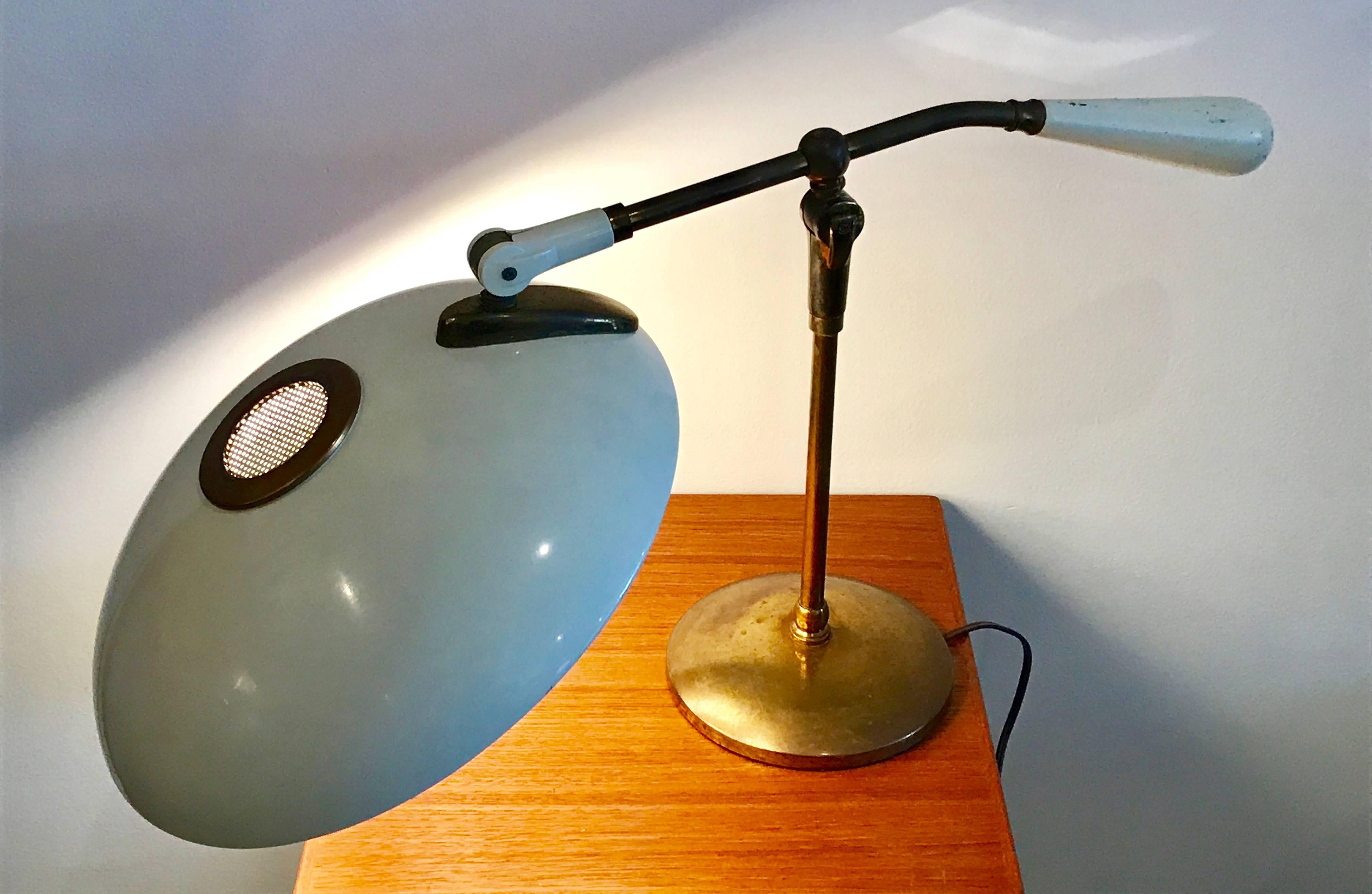 Iconic desk lamp designed by Gerald Thurston for Lightolier, all original, no missing parts or dents, great patina on brass, minor flaking on weighted handle, please see photos. Works great but professional re-wiring recommended.
