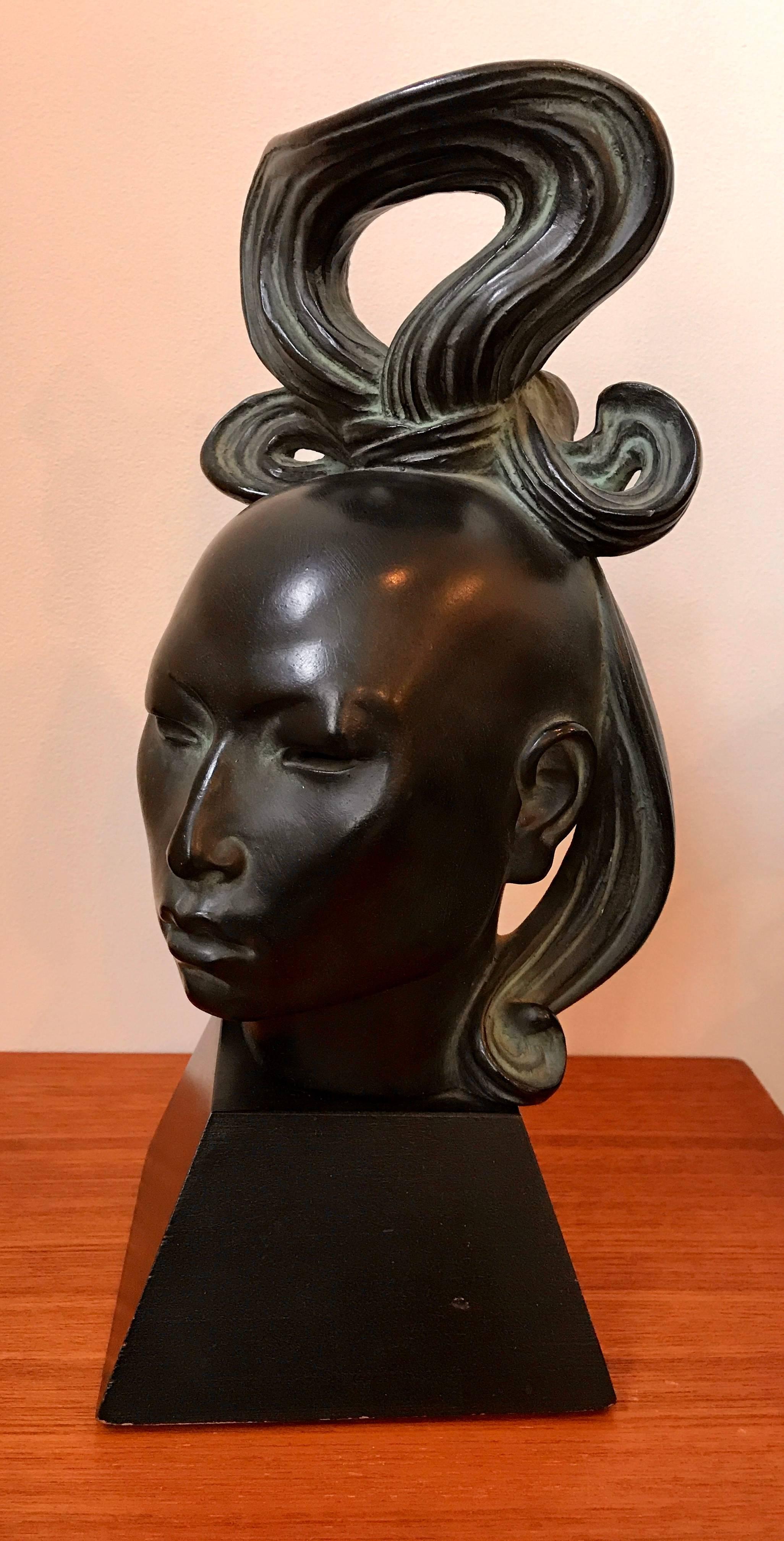 Beautiful African female head sculpture by American artist Fred Press. Matte black cast metal with nice patina.