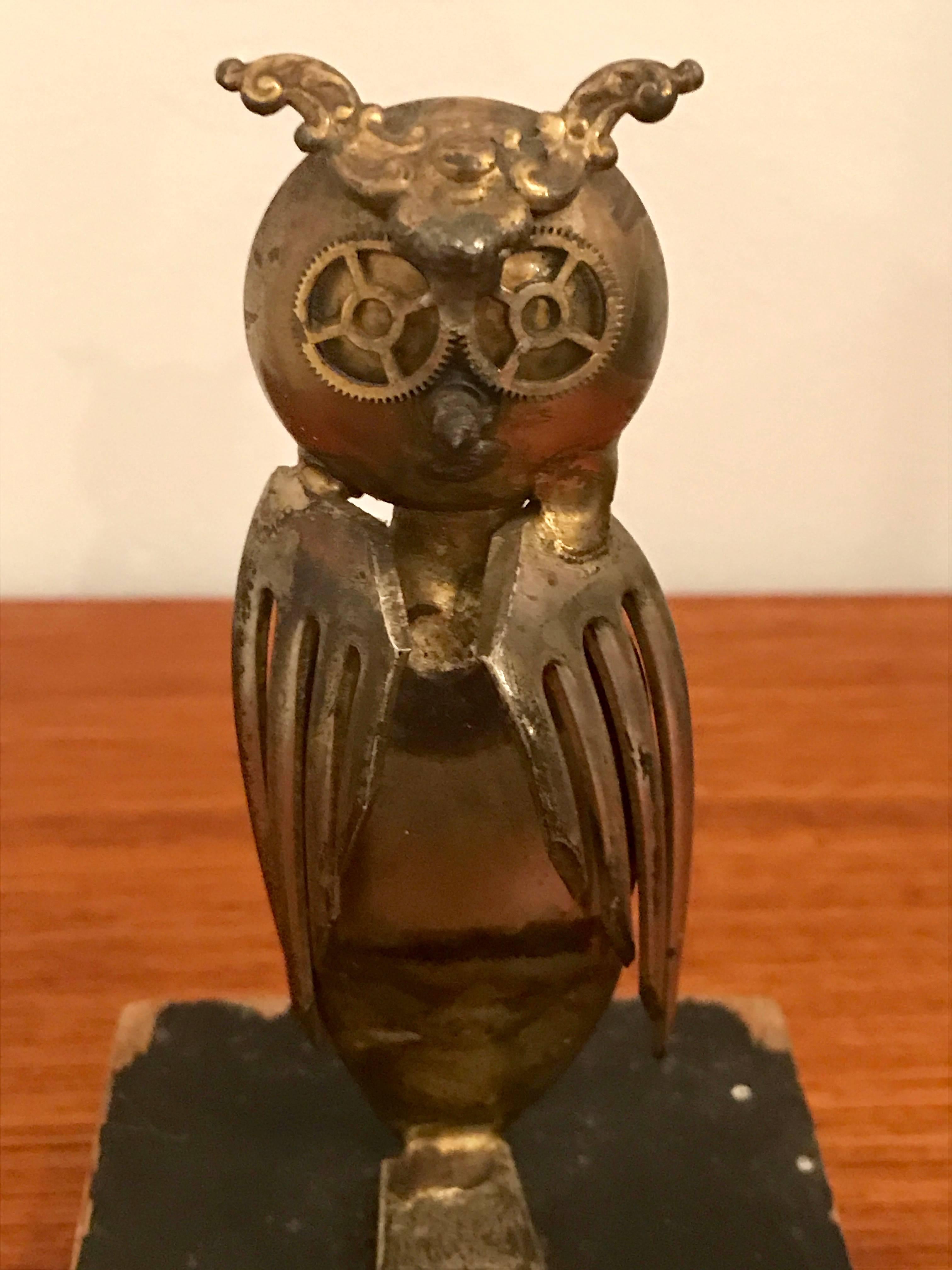 Cute little steampunk brutalist owl sculpture by Casa Del Arte, 1971. Handcrafted using pieces of salad fork, teaspoon, watch gear and wood screw. Mounted on wood base with paint loss. Signed by unknown artist.