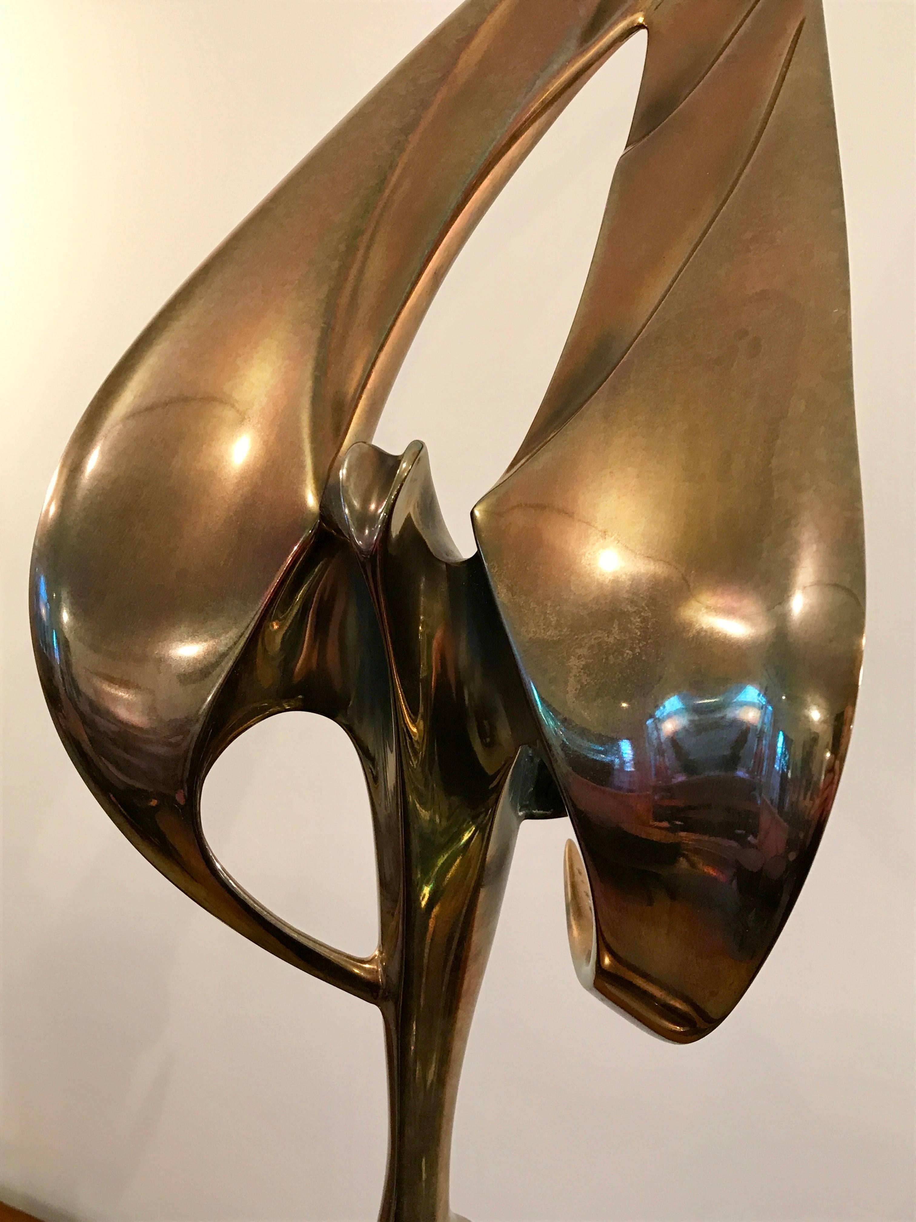 Beautiful highly polished bronze bird perched on a bronze patina rock formation. Titled Birds of Prey. Limited edition 7/50. 

Growing up in Roseville, California, the Bennett brothers began their art career in 1969. They started in an