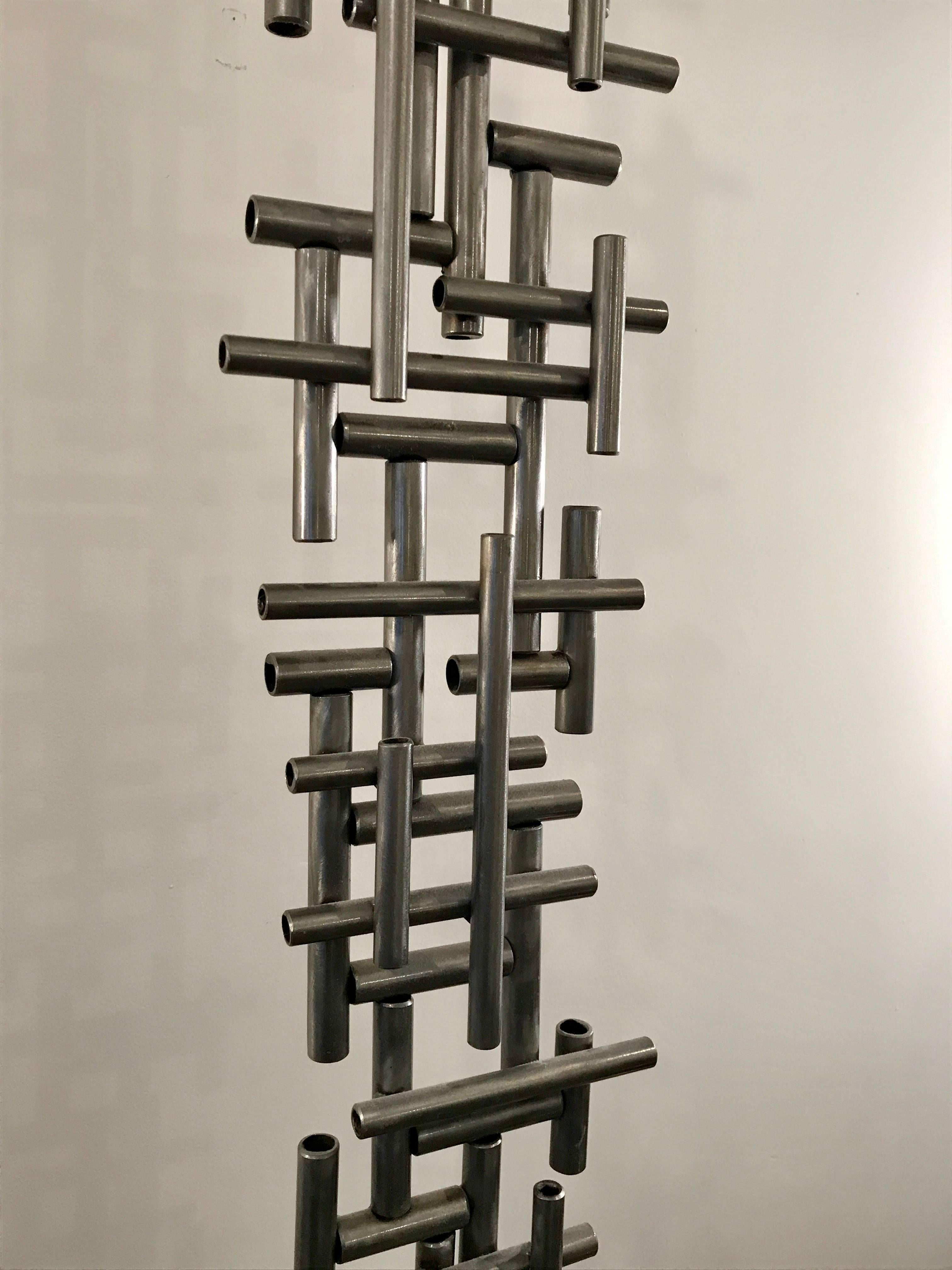 Aluminum welded brutalist pipe sculpture mounted on square metal base, signed by the artist, D. Larson 2011