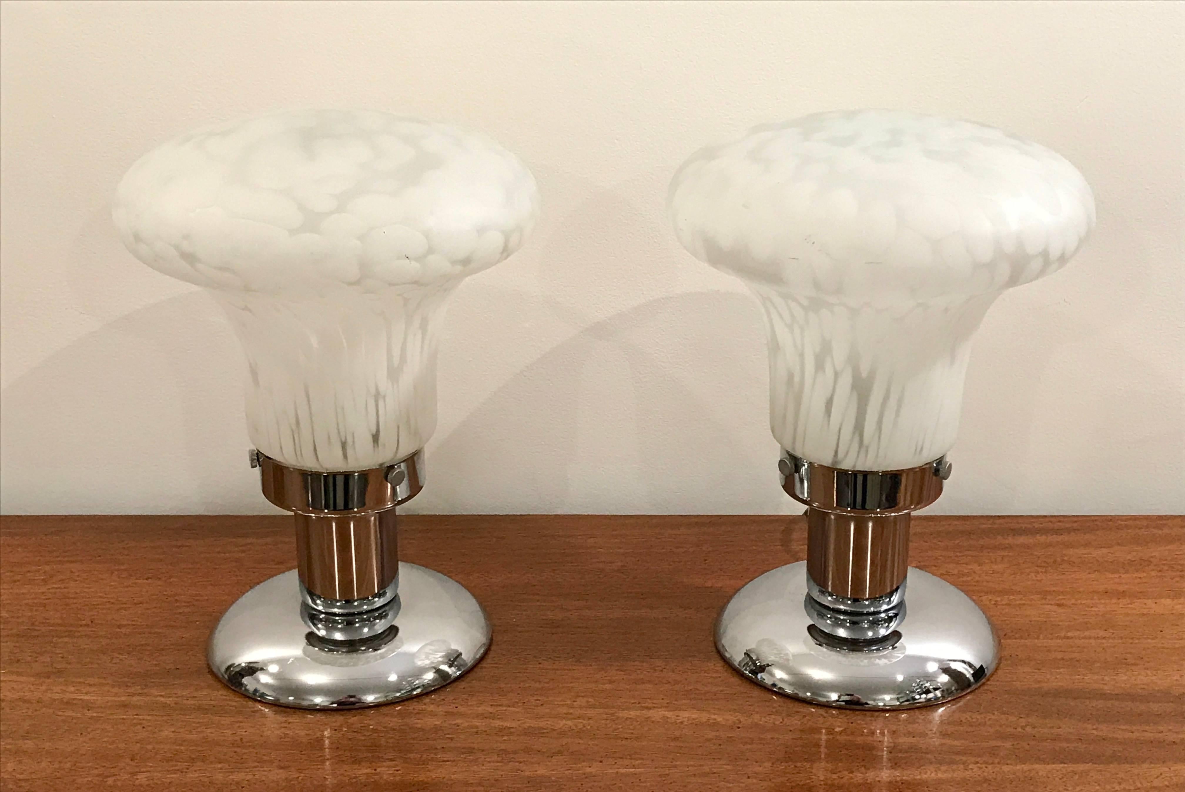 Lovely pair of Art Deco table lamps for your library or mantel.  Beautiful blown spotted leopard white murano glass globes, mounted on chrome circular bases.  Three way in line switches.  Rewiring recommended.