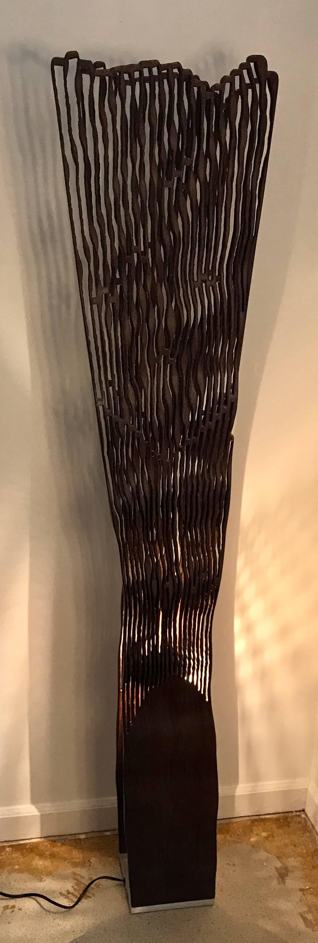 Beautifully crafted Floor lamp designed and made of olivewood by Pyka-Leone, Italy. Its organic shape is made out of olivewood, the very symbol of the Mediterranean spirit and history that tells of the ancient pulse and mysteries binding man and