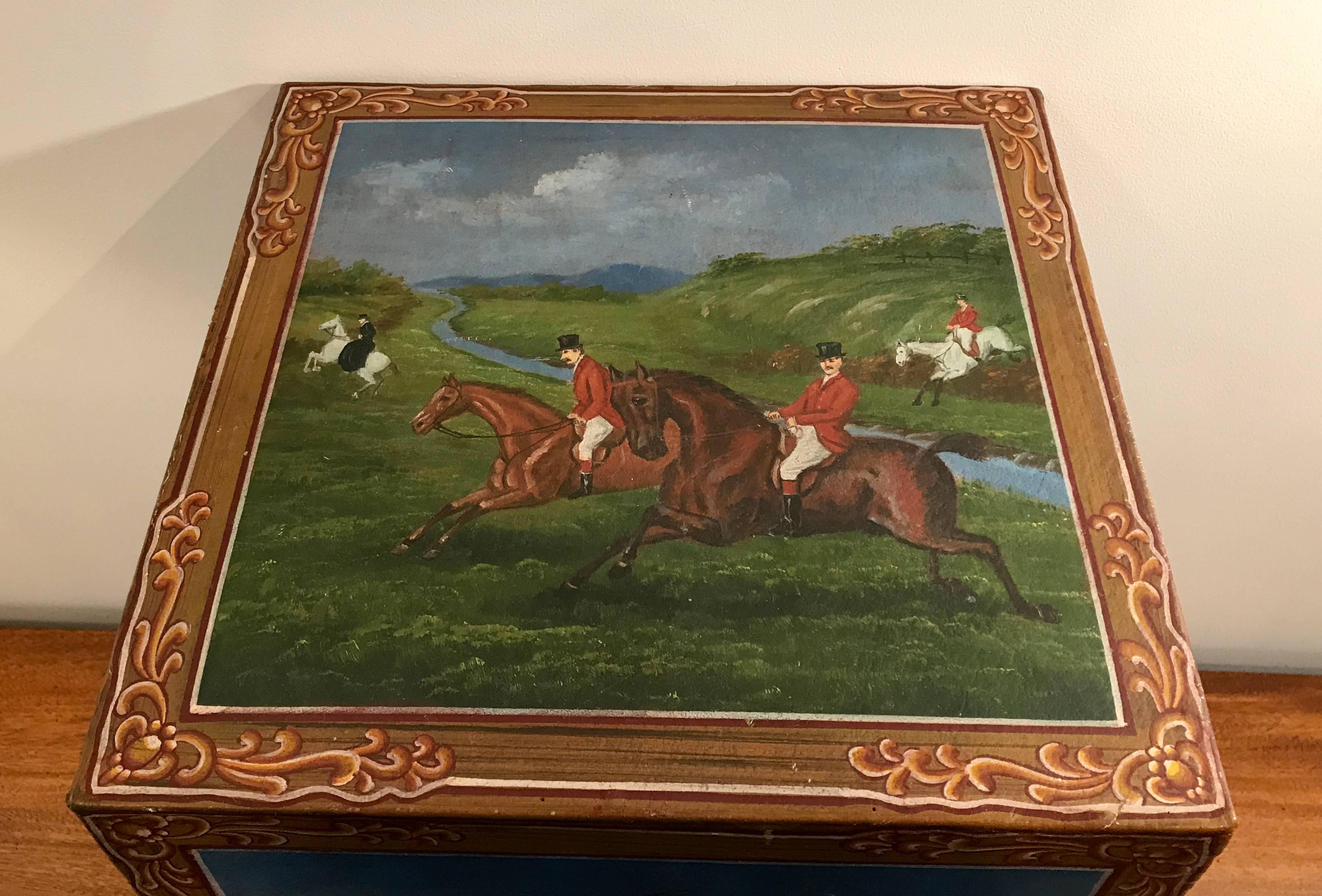 Beautiful hand-painted Arts & Crafts horse tack box consisting of five stackable storage compartments. Painted on leather. Very well made with detailed corner stitching. The top of the box depicts four equestrian riders, the front depicts a man