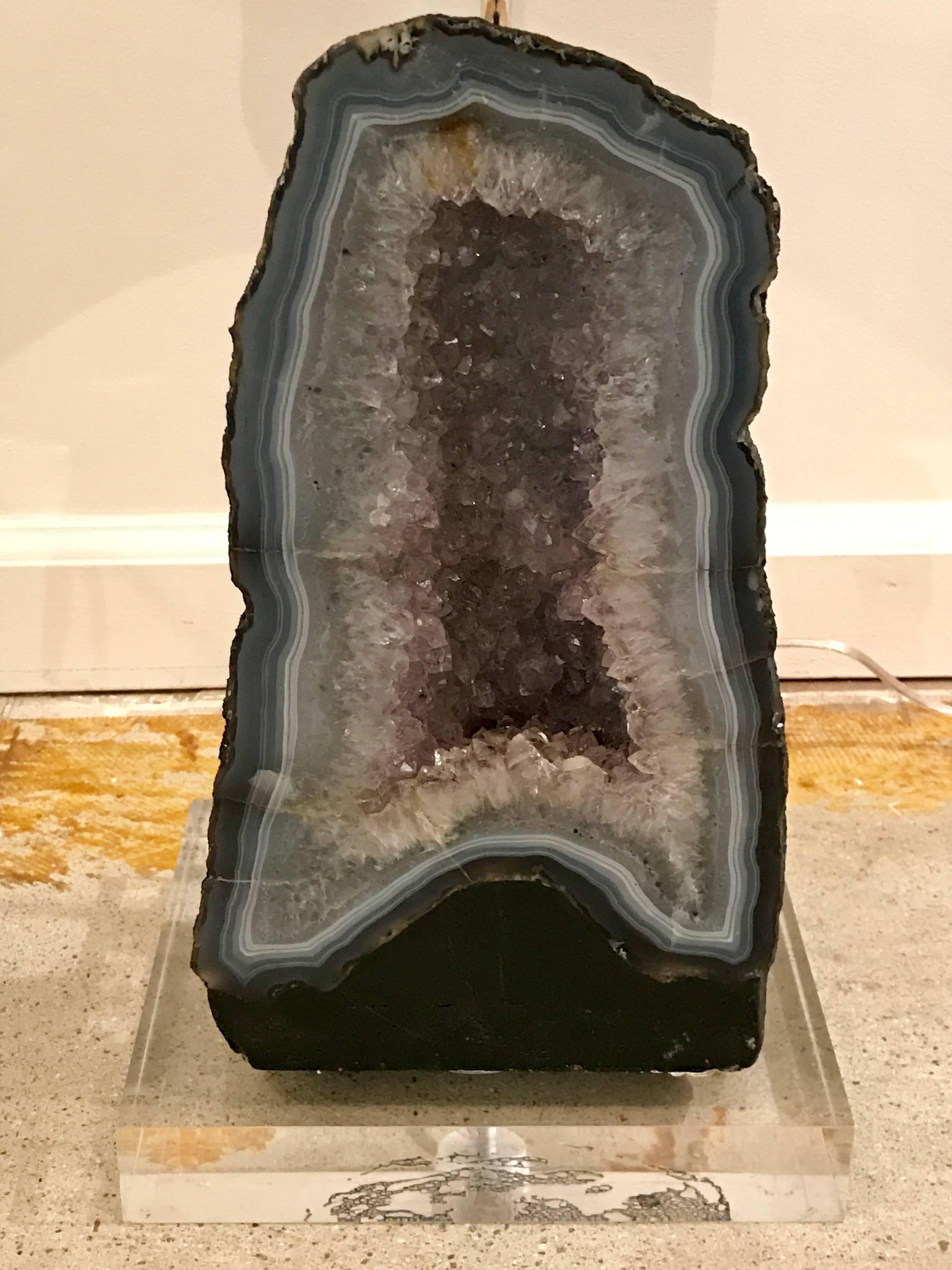 Beautiful amethyst geode table lamp in the style of Willy Daro. Mounted on square lucite base with chrome stem and socket. Shade not included.