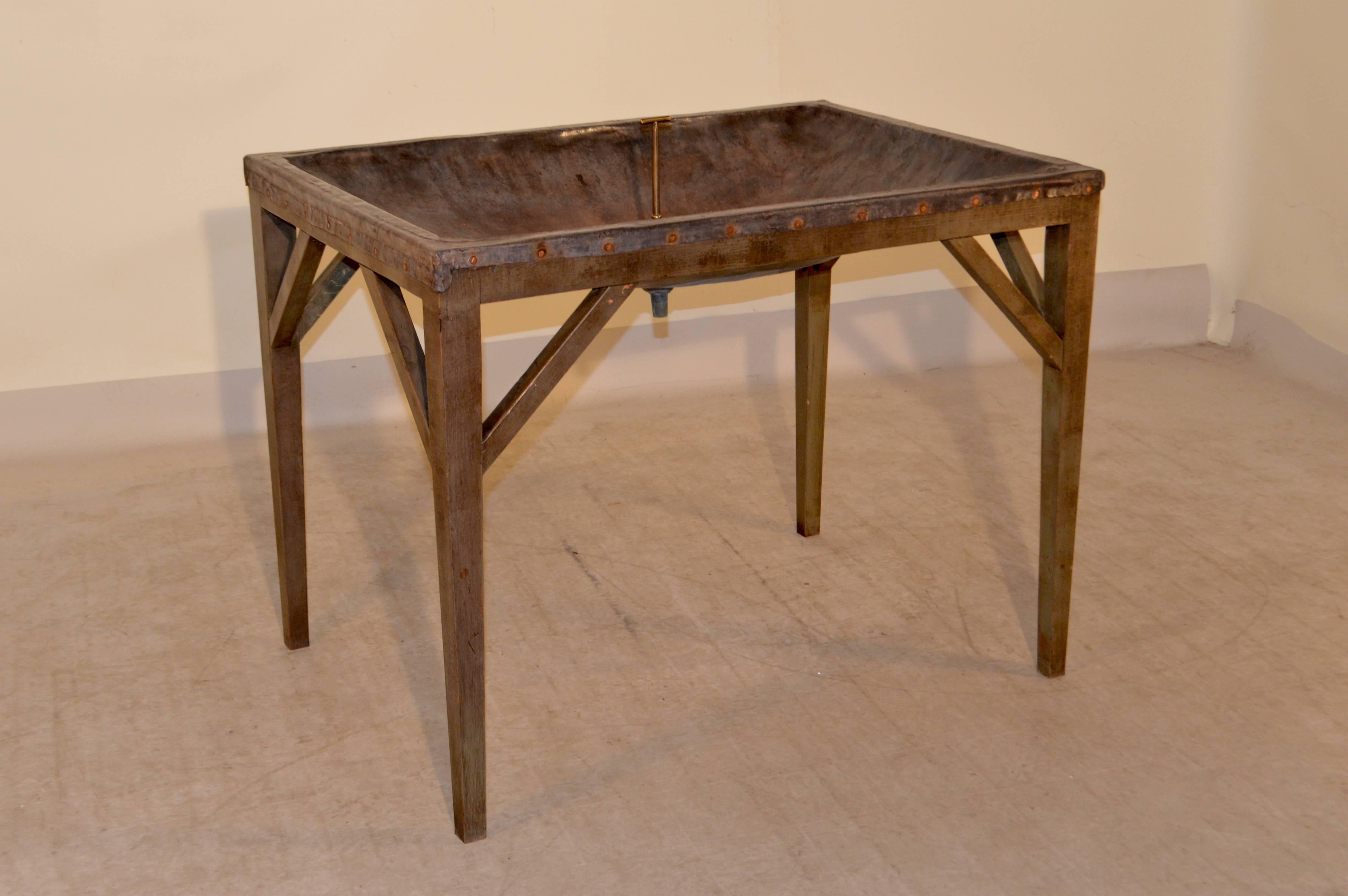 19th century unusual English dairy skimming table with zinc top and original brass drain plug. The table was used to skim the cream from the top of milk in early dairies. These are fantastic for wine and drink coolers filled with ice! The trough