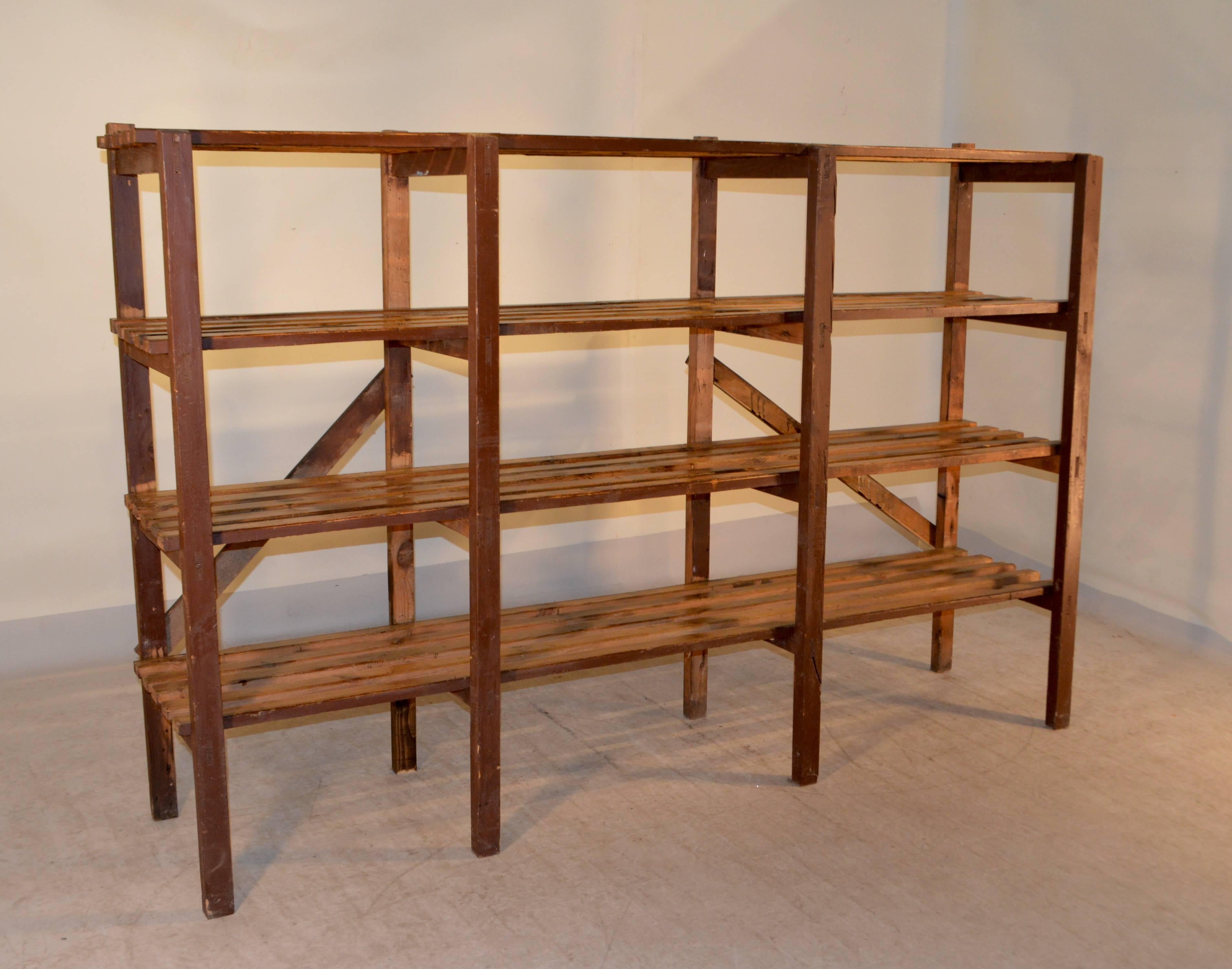 19th century French bakery stand with four slatted shelves, which were optimal for cooling baked goods. The shelves are supported on simple supports and braced by cross braces.