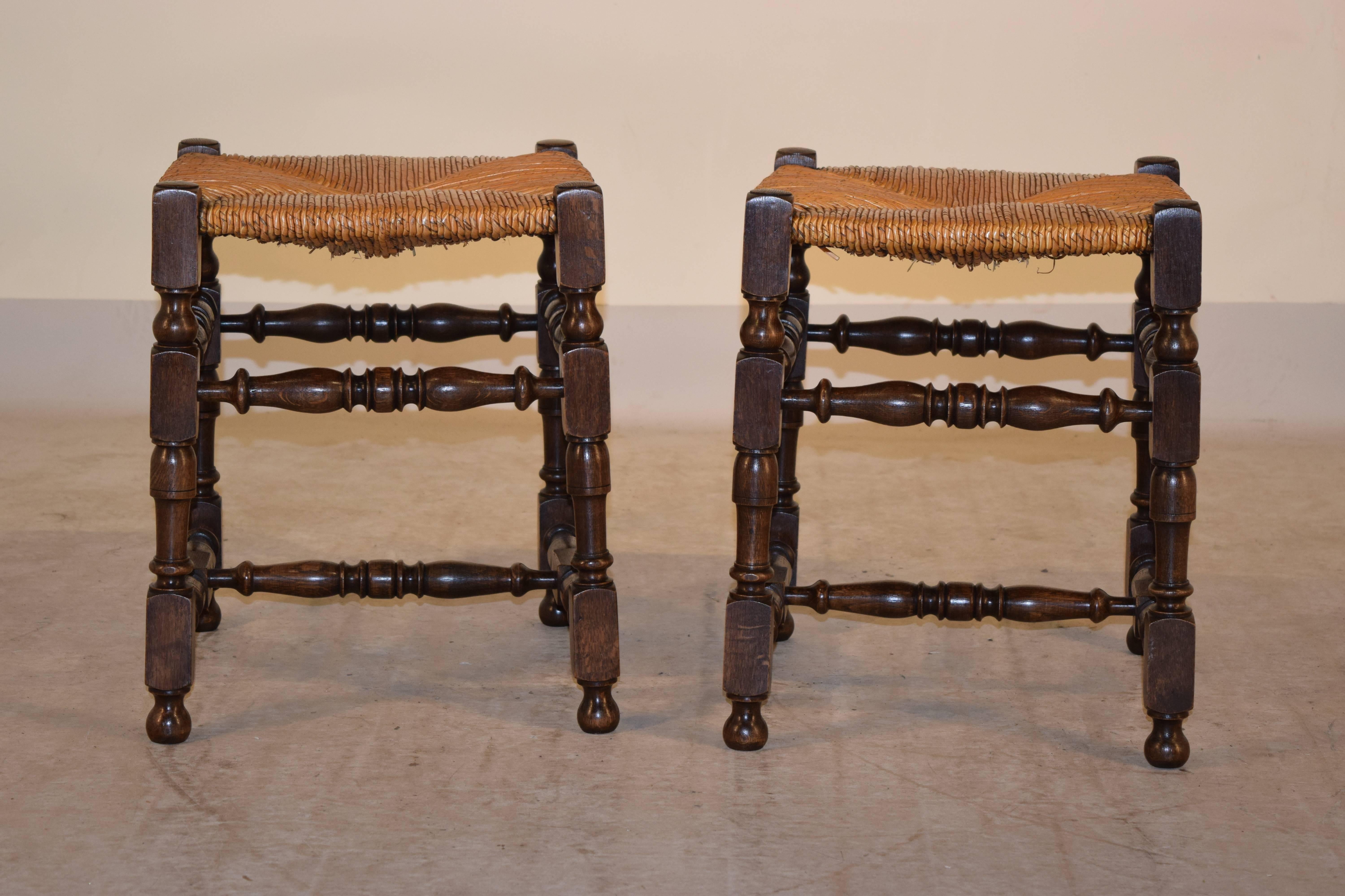 Pair of late 19th century French stools made from oak with rush seats and hand-turned legs and stretchers.