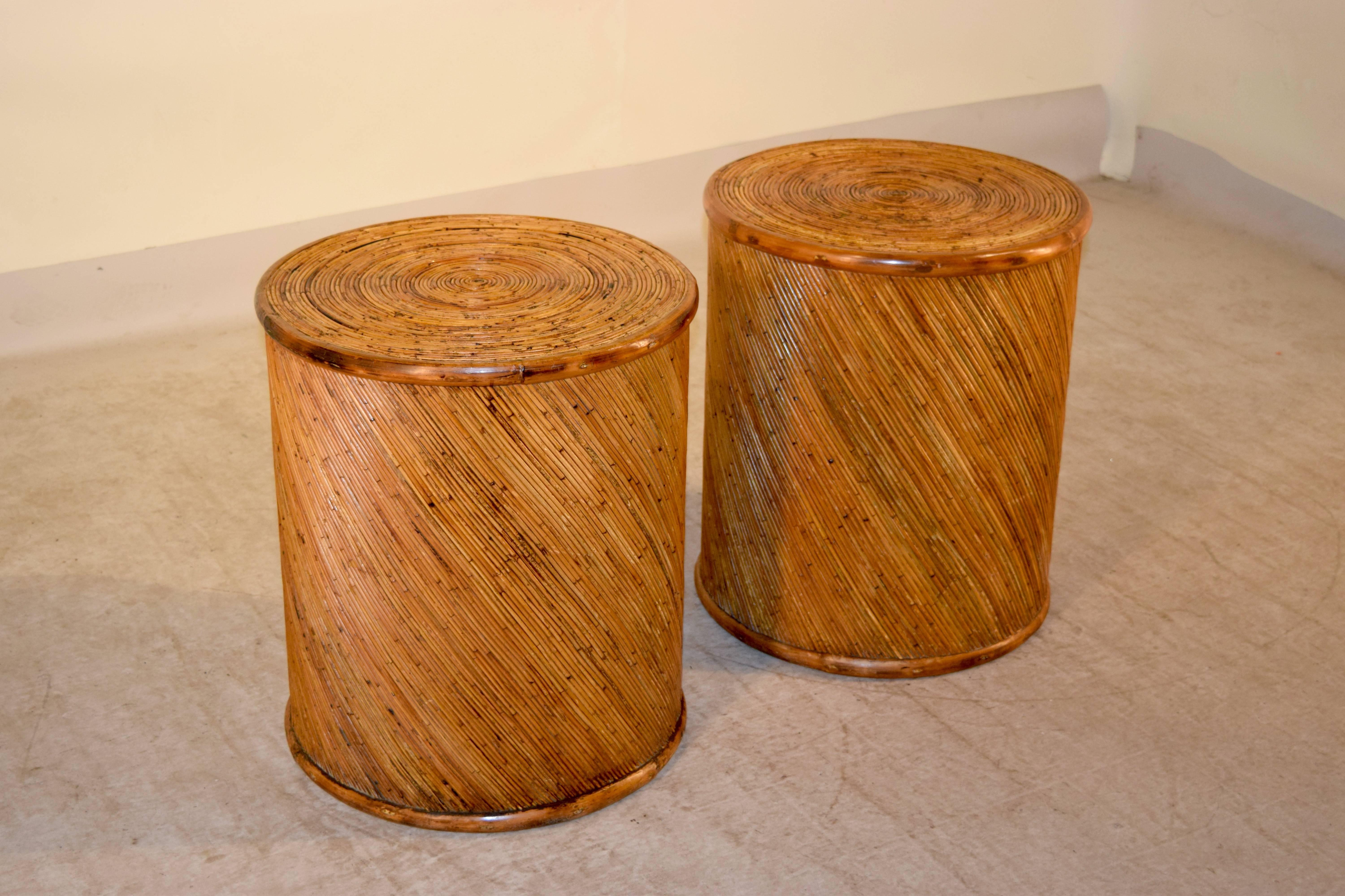 Pair of 1970s drum shaped bamboo side tables from France. The bamboo is applied in a diagonal pattern on the sides and in a circular pattern on the top.
