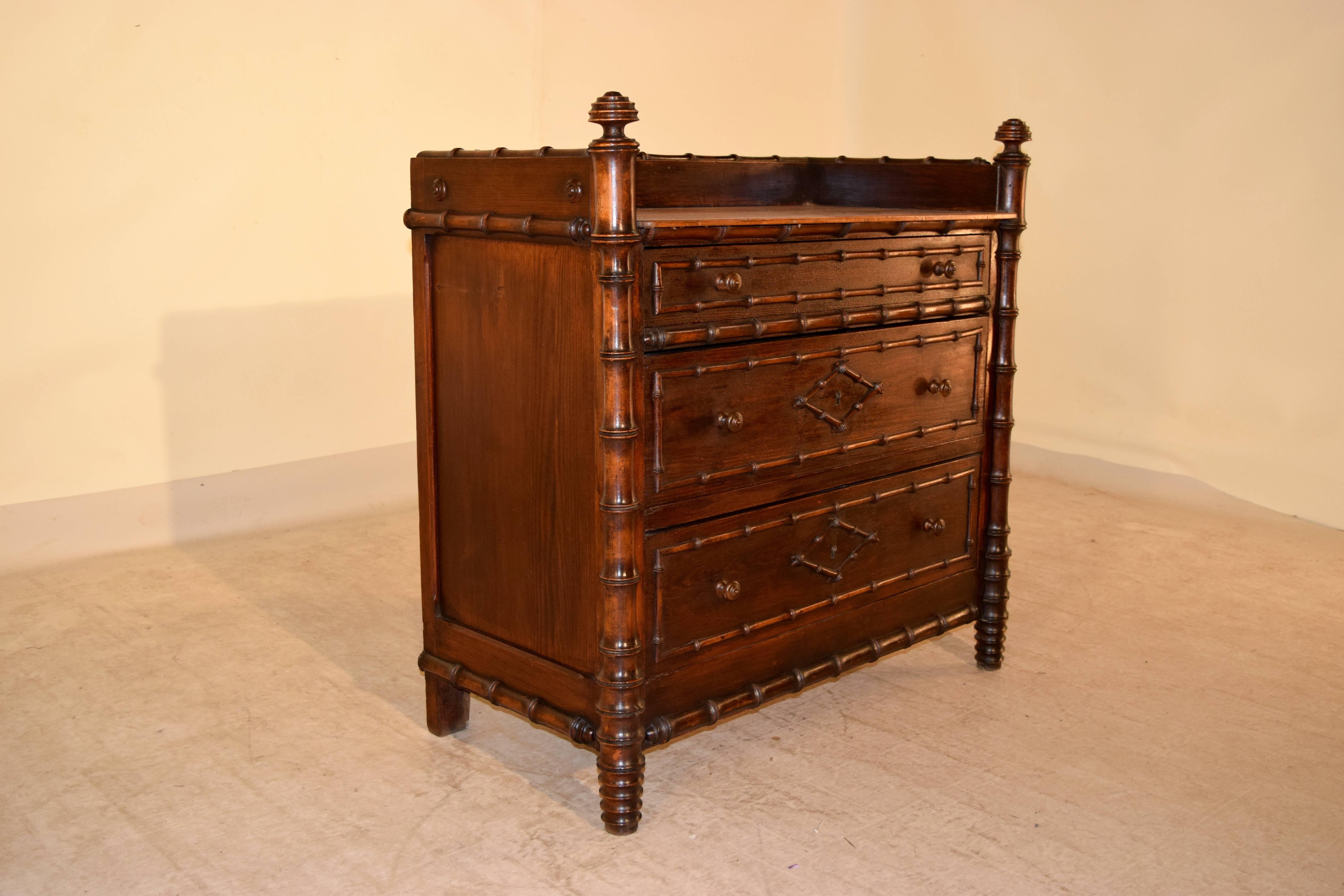 19th century French pine wash stand in the faux bamboo style. The height of the top measures 32