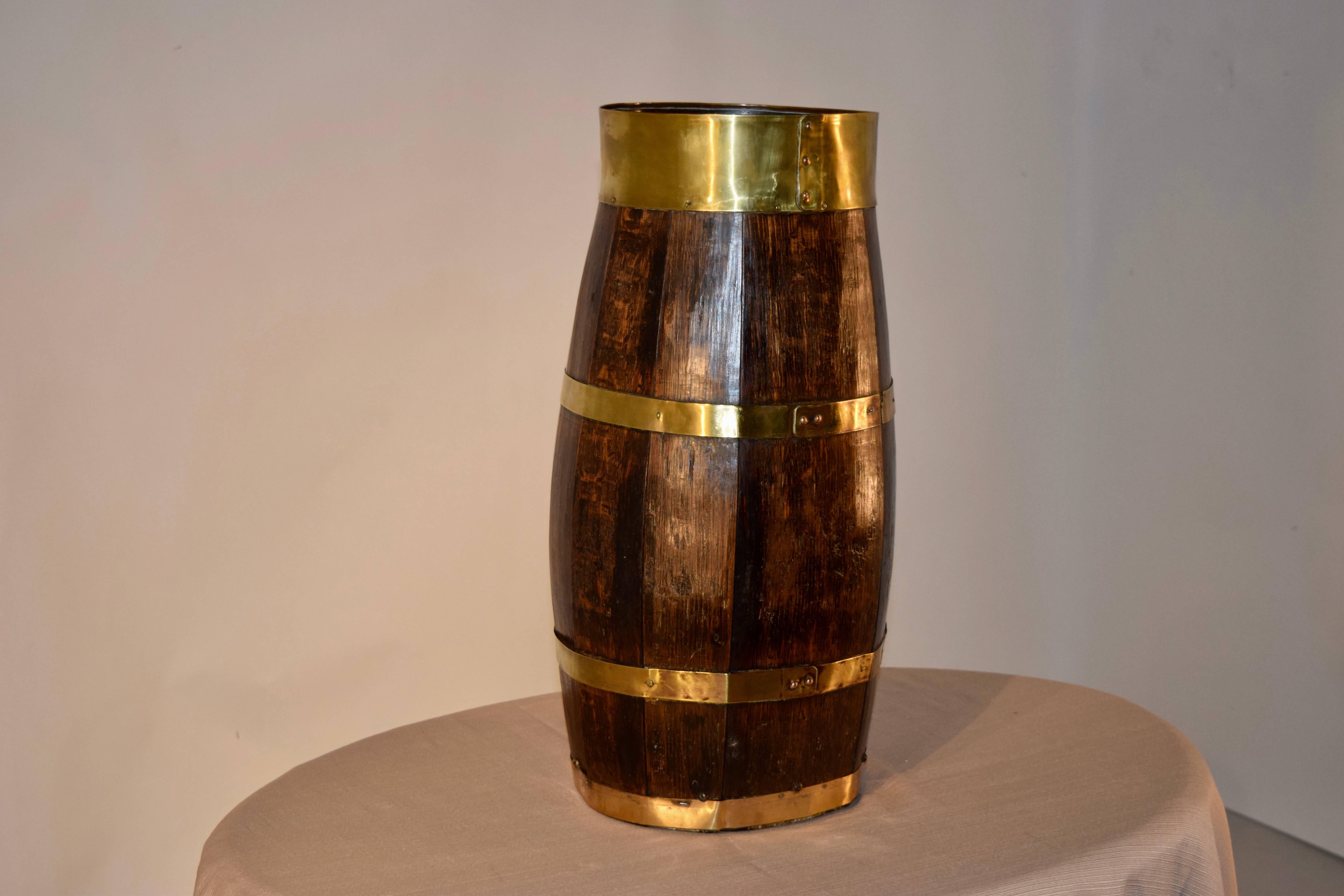 19th century English oak cane stand banded in handmade brass bands.