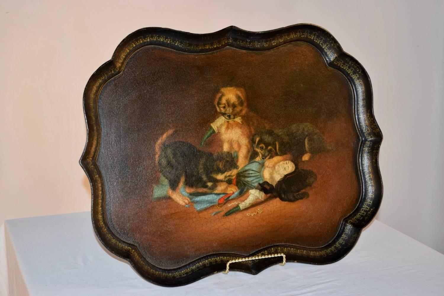 19th century papier mâché tray depicting three terrier puppies tearing apart a doll toy, hand-painted on a wonderful Gothic-shaped tray by B. Walton & Co.
Benjamin Walton took over the running of the firm of Walton & Co. at Old Hall in Wolverhampton